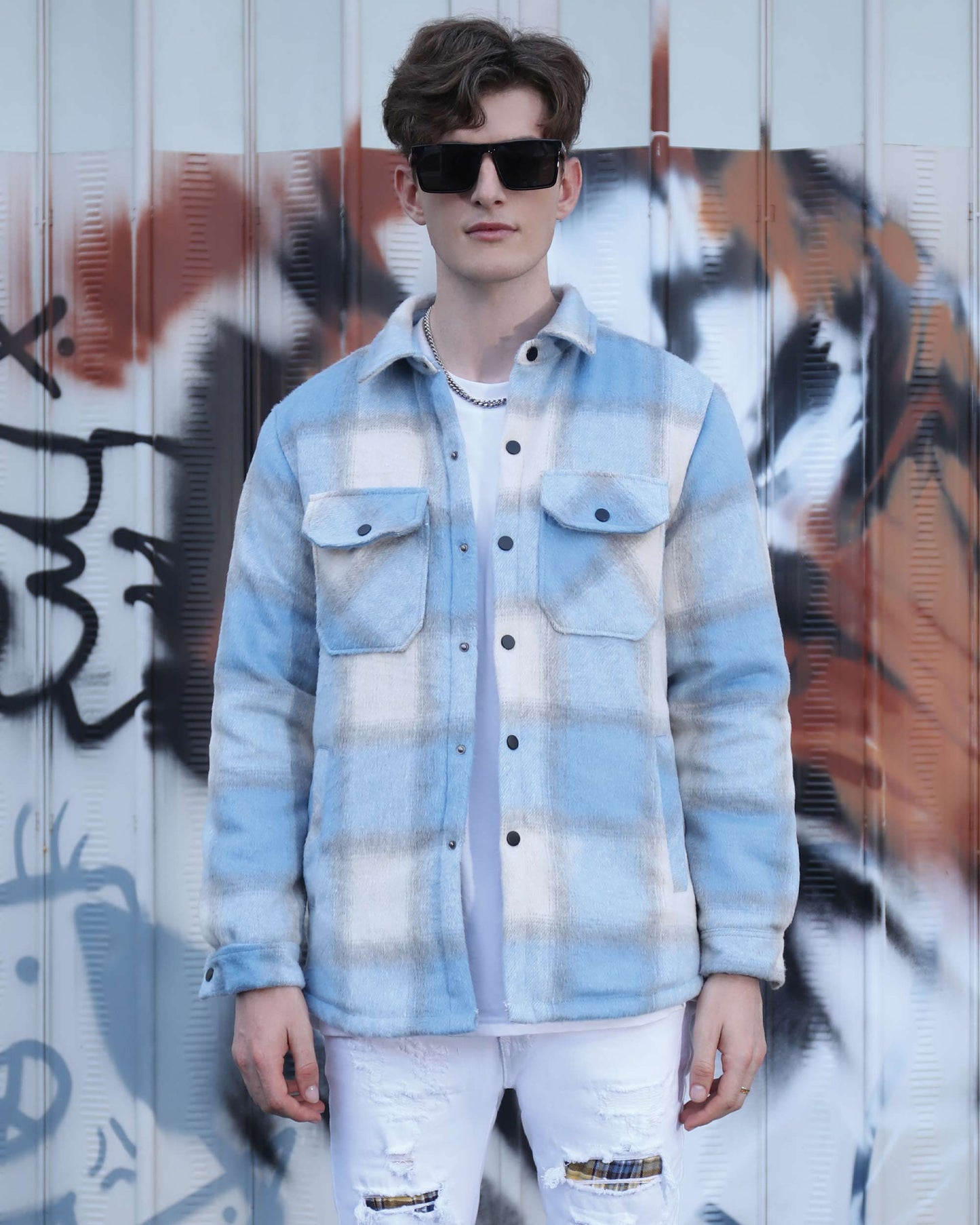 Man wearing a light blue and white spring plaid jacket with button pockets by Logeqi