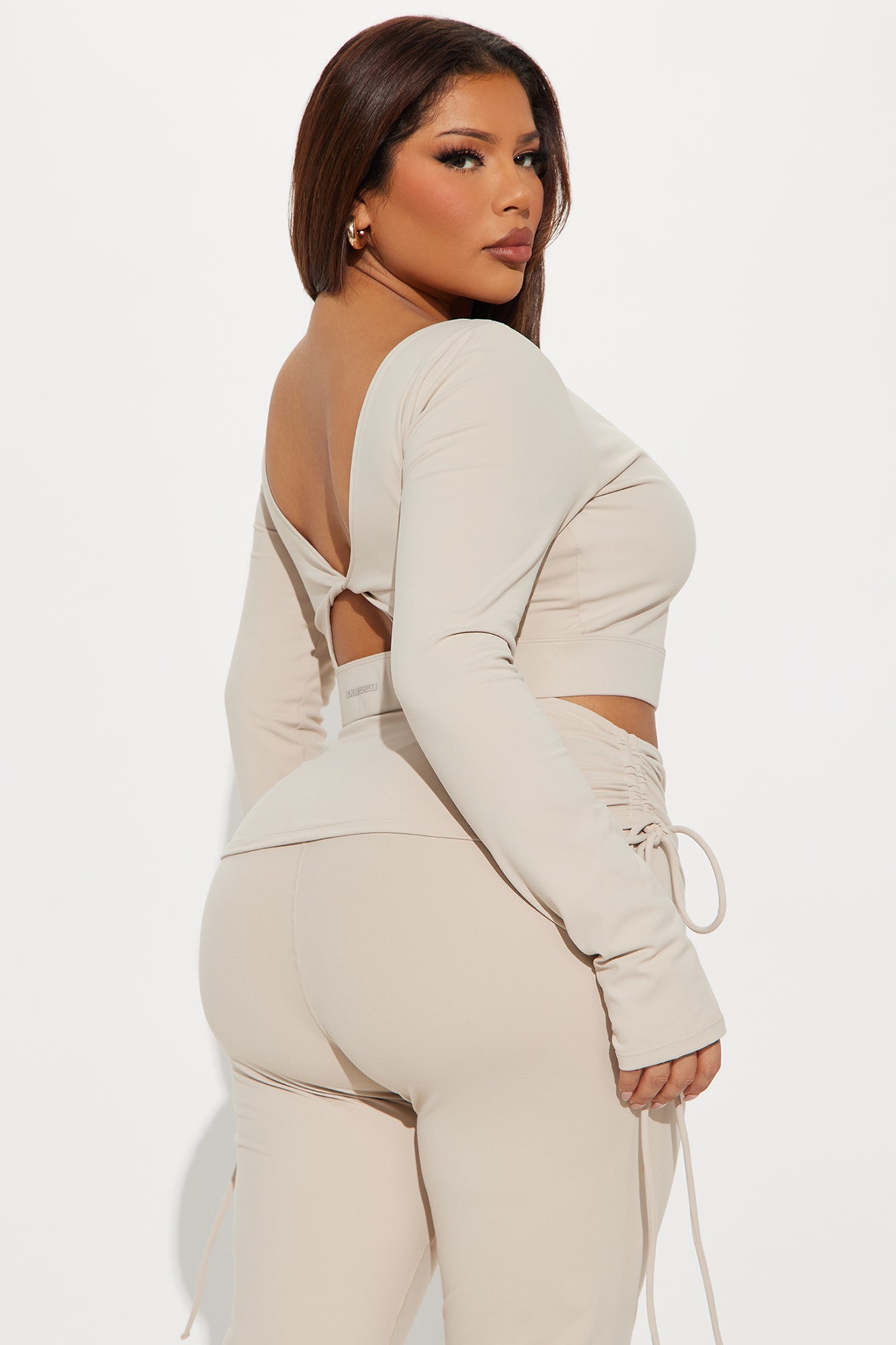 Fashion Nova super soft active top in beige with stylish back cutout and long sleeves