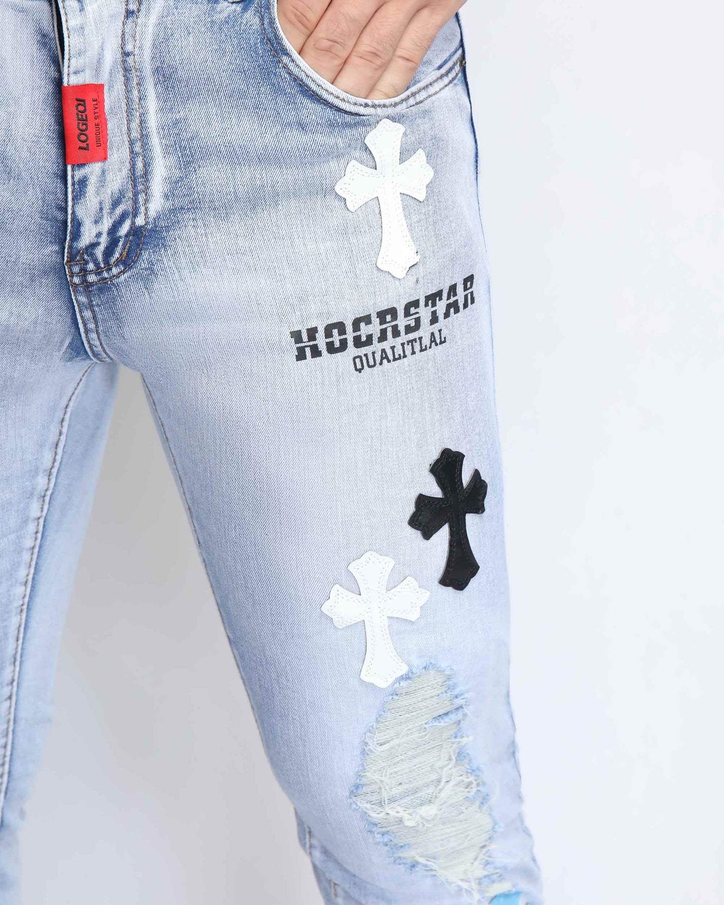 Logeqi trendy distressed jeans in light blue with cross patches and ripped details
