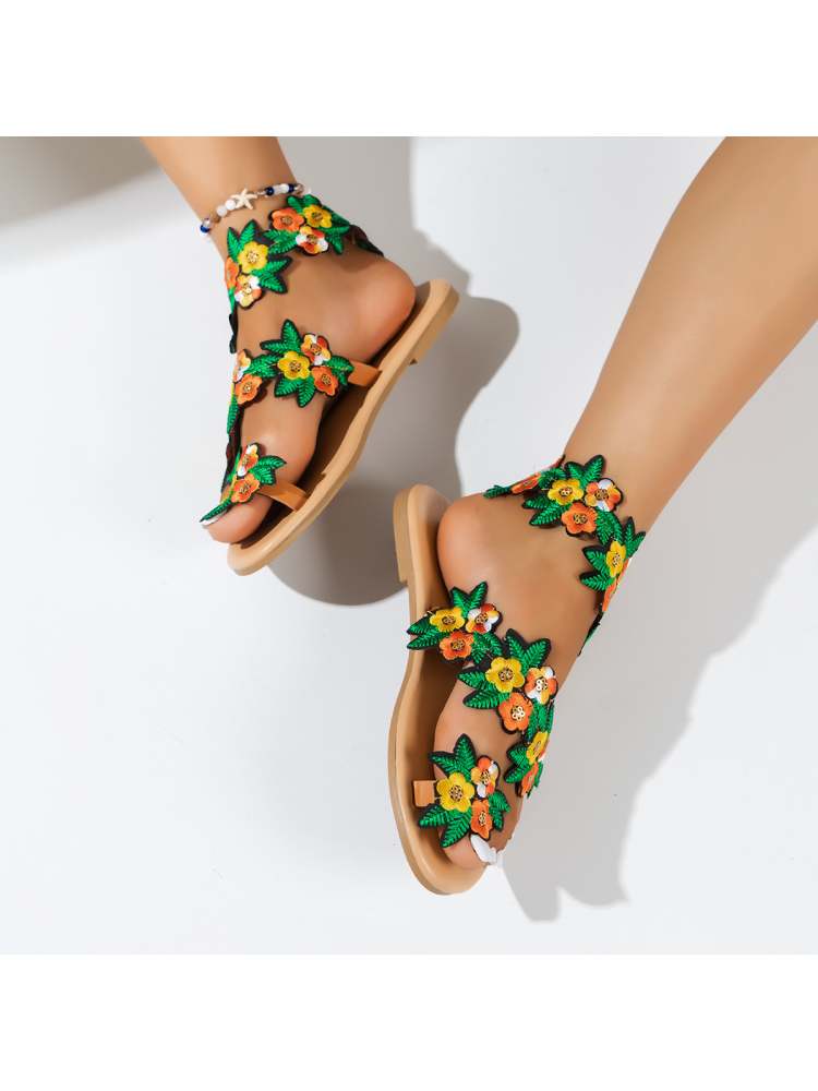 Wholesale7 tropical flower sandals with colorful floral design on black straps and tan soles