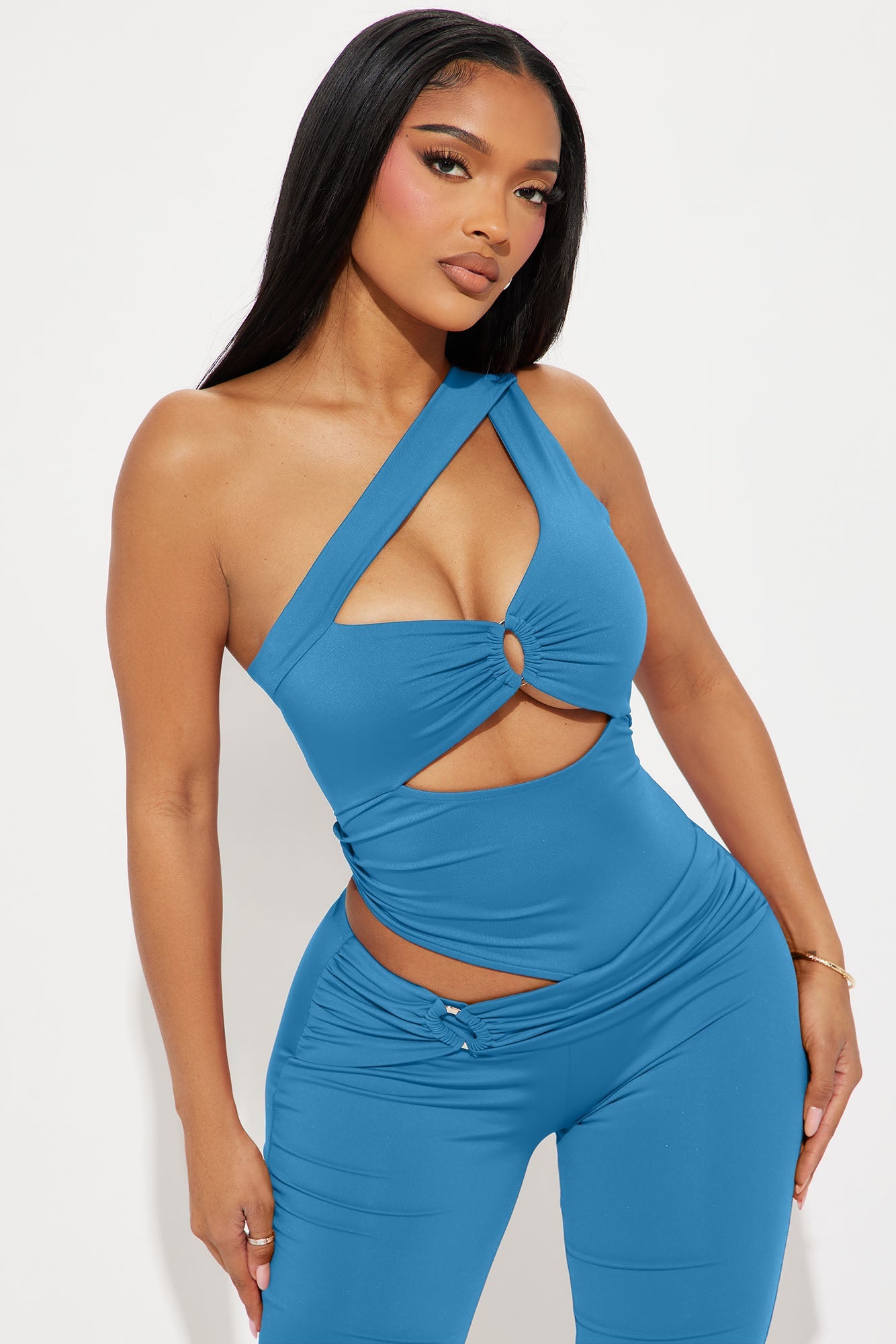 Fashion Nova turquoise cut out jumpsuit featuring a stylish design and flattering fit