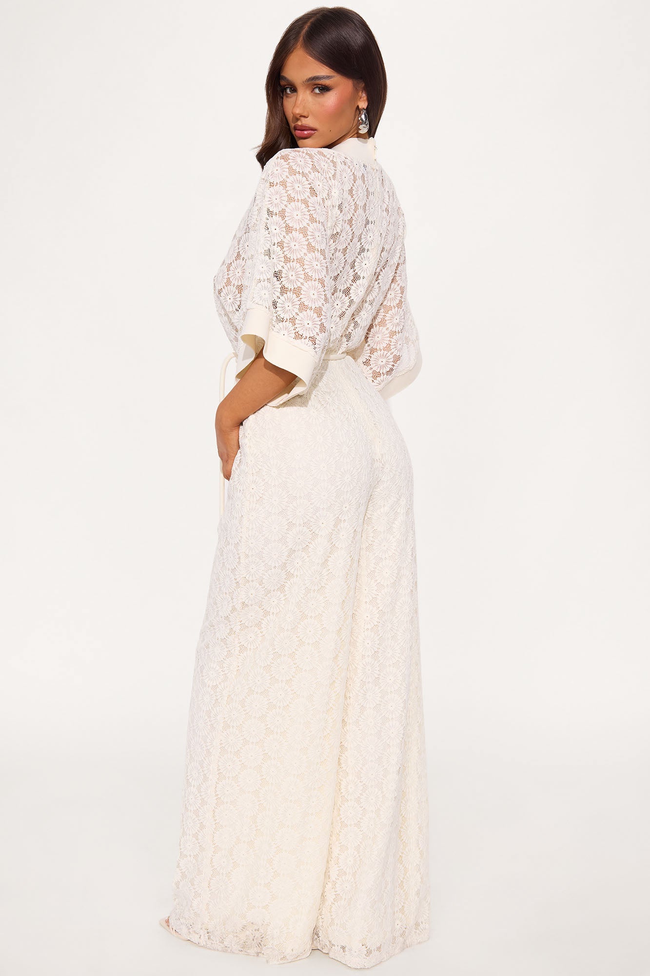 Fashion Nova crochet wide leg jumpsuit in white with intricate lace pattern and relaxed fit