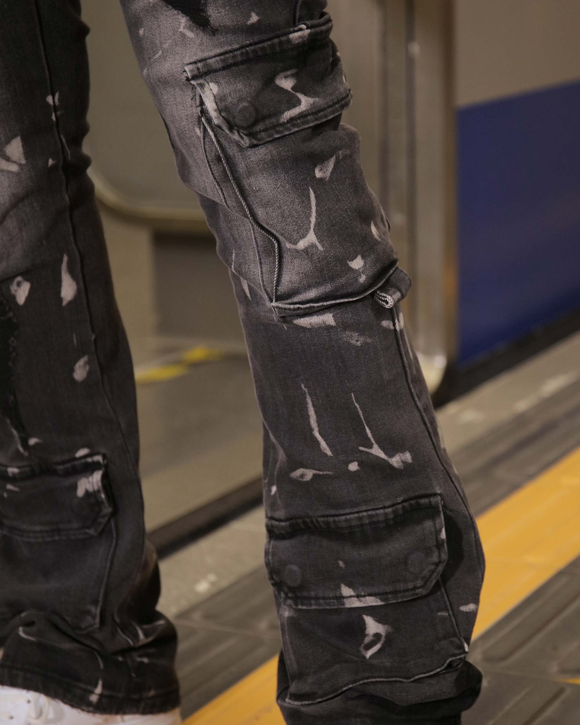 Logeqi distressed black cargo jeans with multiple pockets and a worn, splattered design