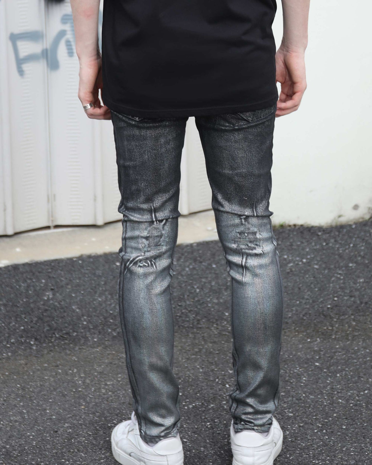 Logeqi gradient ripped black jeans with distressed detailing worn by person standing outdoors