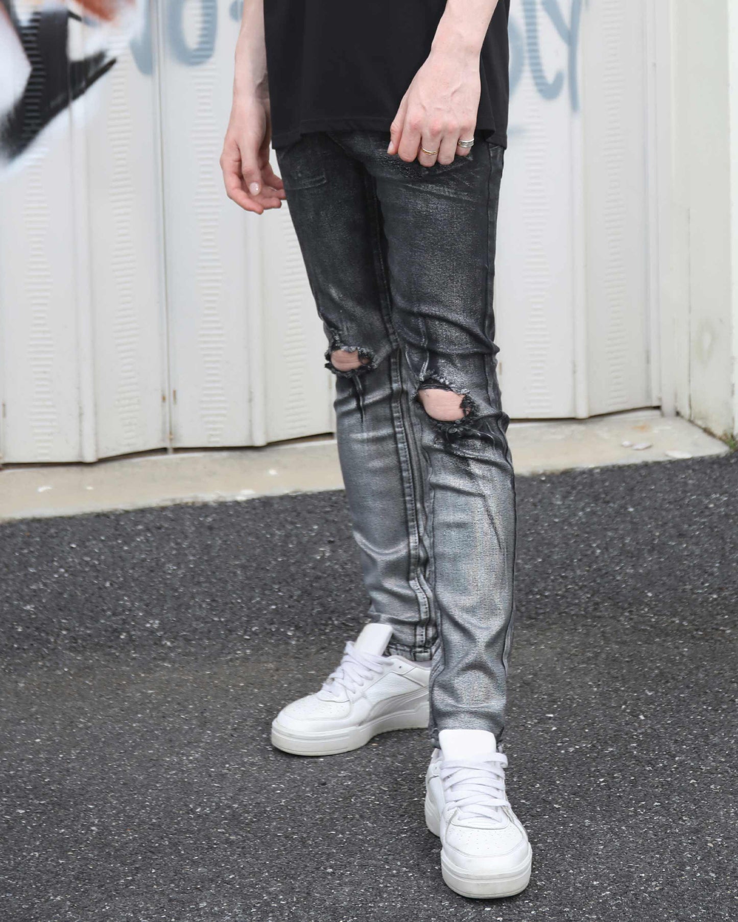 Logeqi gradient ripped black jeans with distressed knee details worn with white sneakers