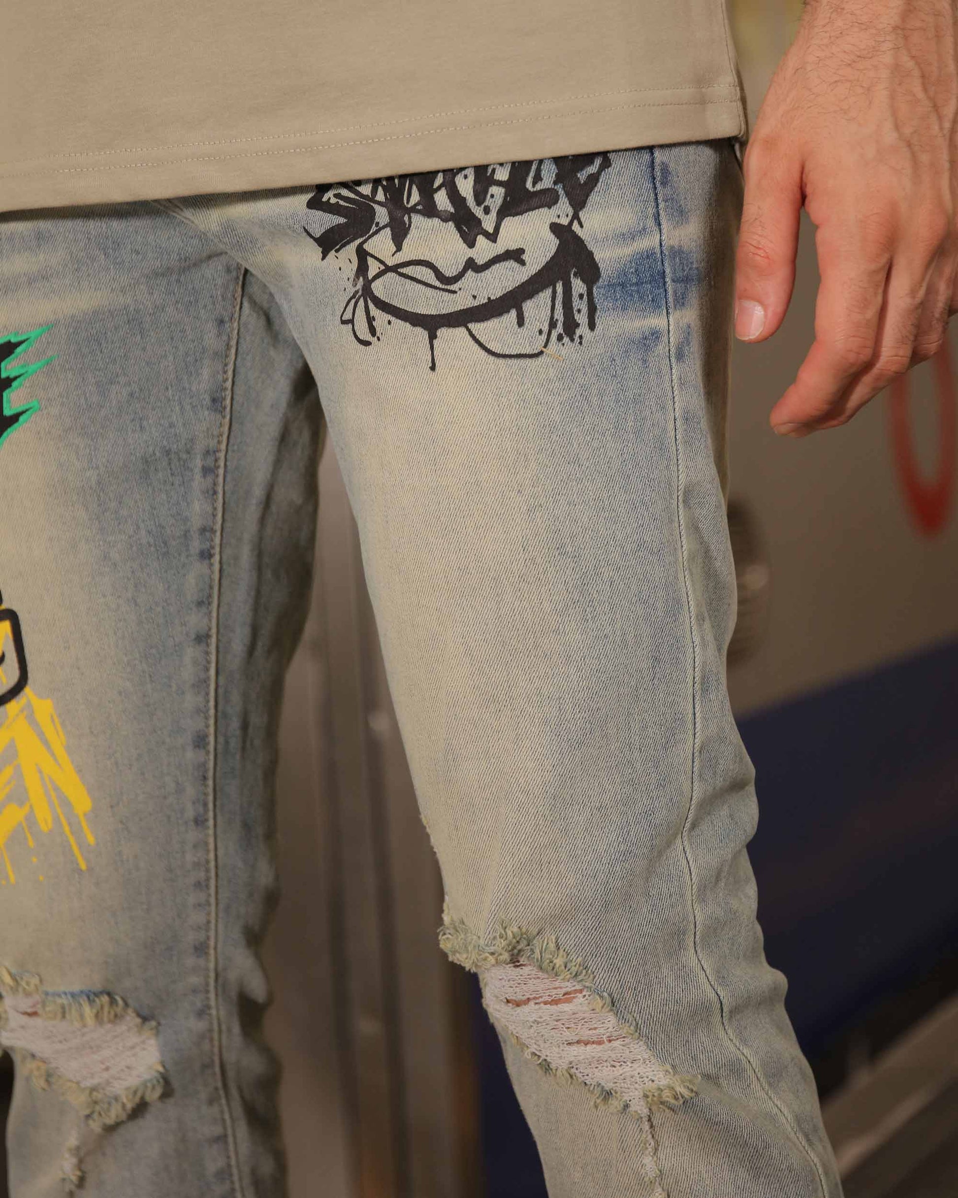Logeqi graffiti streetwear jeans with colorful graffiti design and distressed details on light blue denim