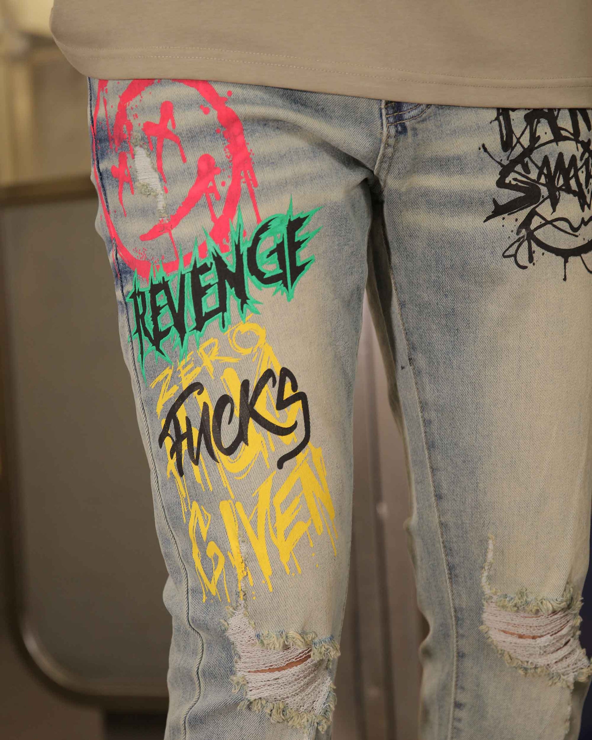 Logeqi graffiti streetwear jeans with colorful graphic prints and distressed details on light wash denim