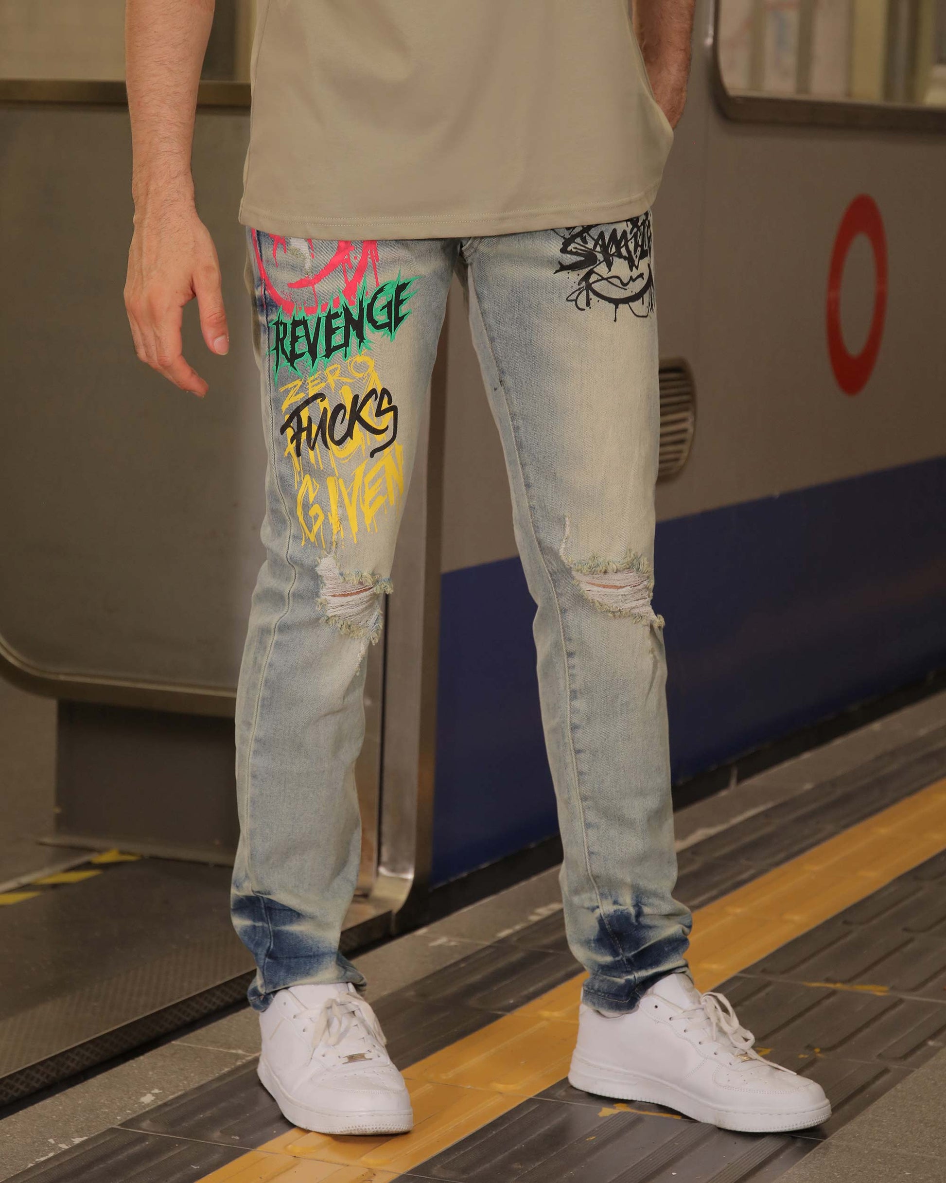 Logeqi graffiti streetwear jeans with colorful graphic designs and distressed details worn with white sneakers