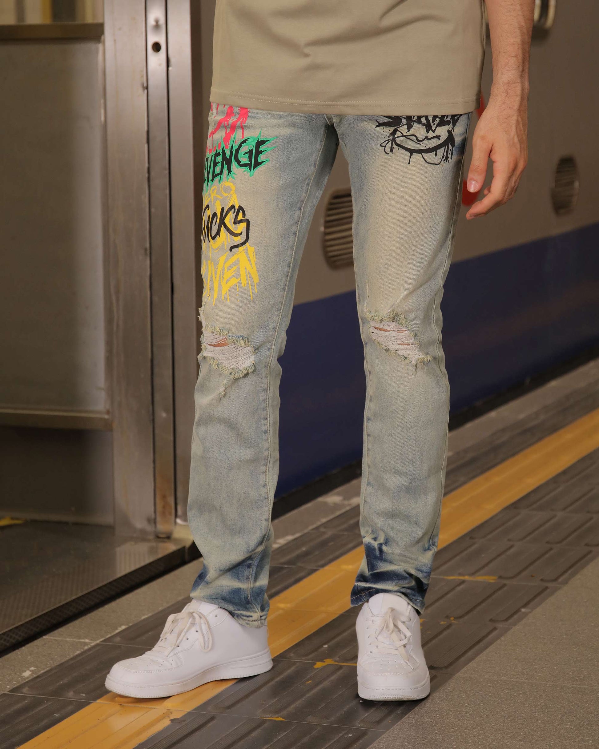 Logeqi graffiti streetwear jeans with colorful designs and distressed detailing on light denim