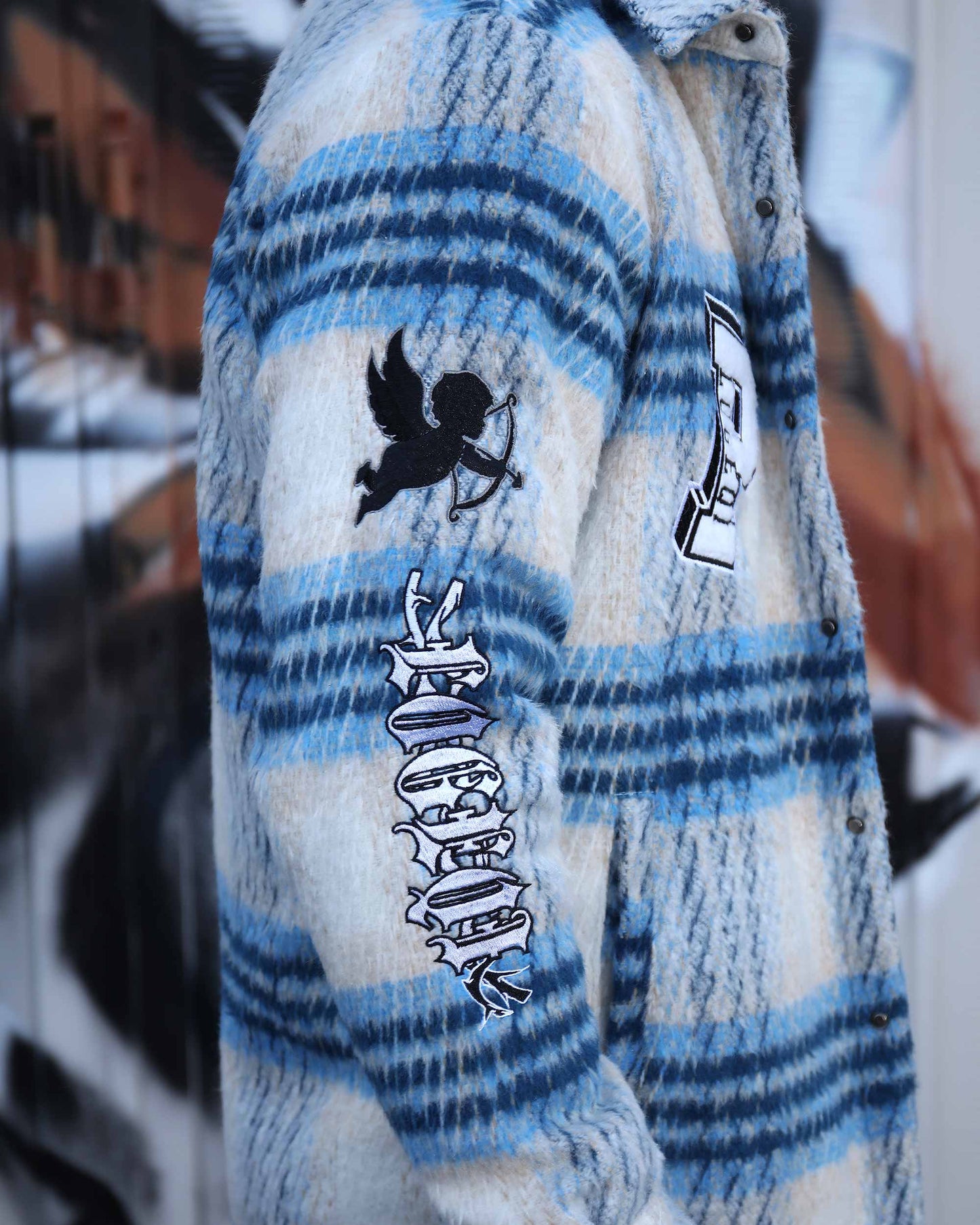 Logeqi insulated plaid moto jacket in blue and white with black graphic prints on sleeve and chest