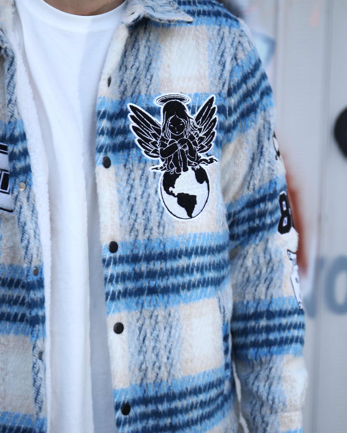 Logeqi insulated plaid moto jacket in blue and white with black snap buttons and graphic patches