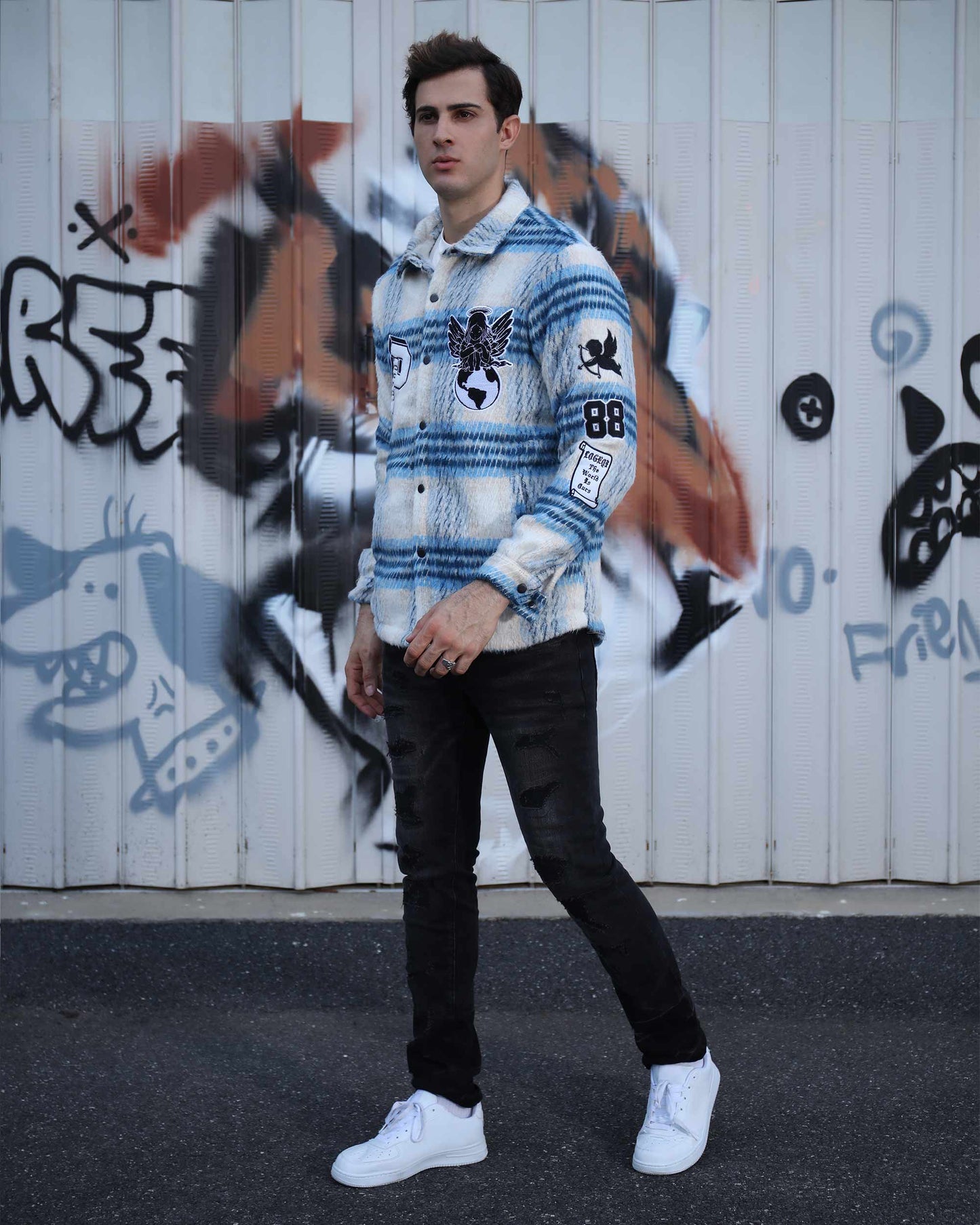 Logeqi insulated plaid moto jacket in blue and white worn by a man with black pants and white sneakers