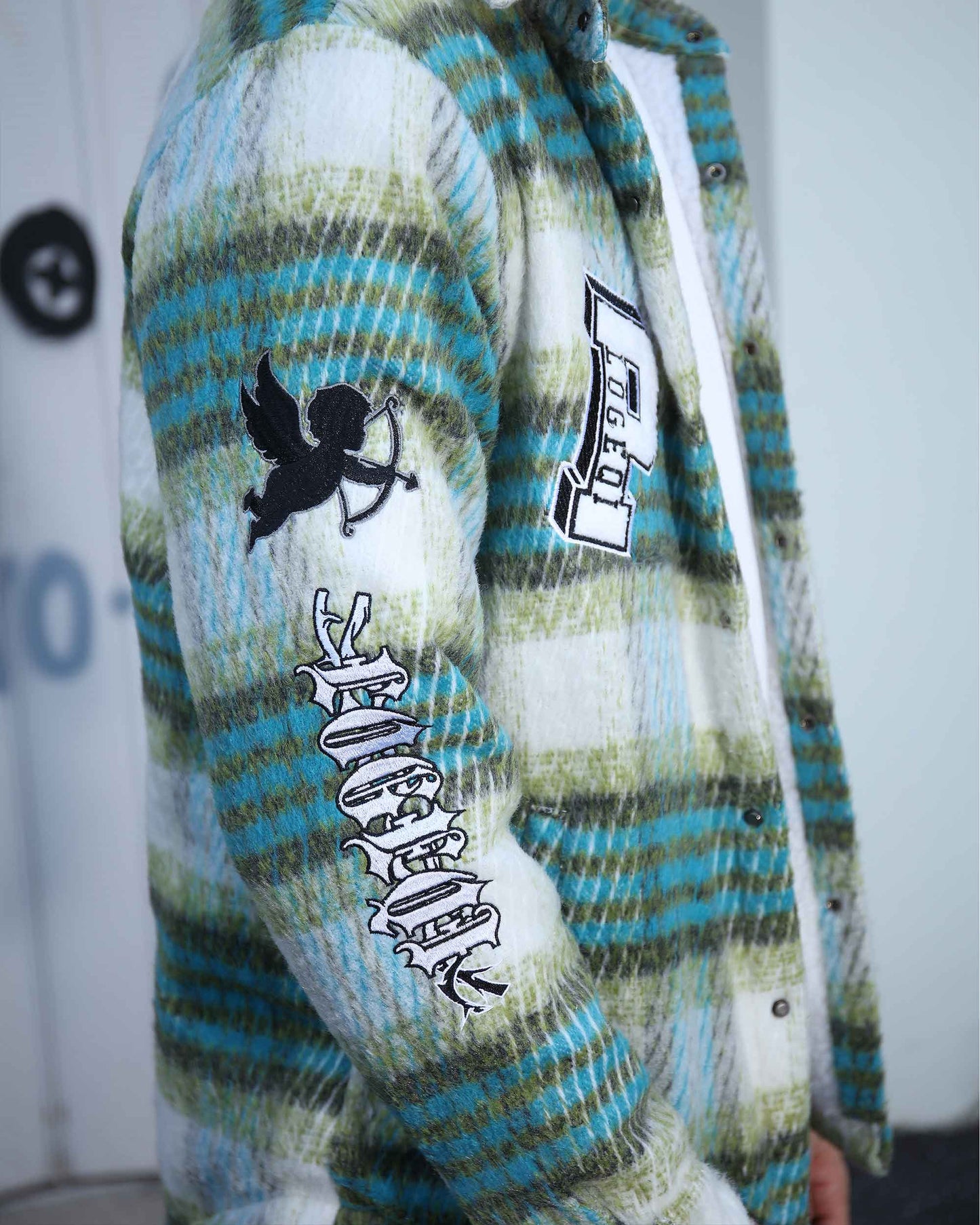 Logeqi insulated plaid moto jacket in green and blue with graphic patches on sleeve and chest