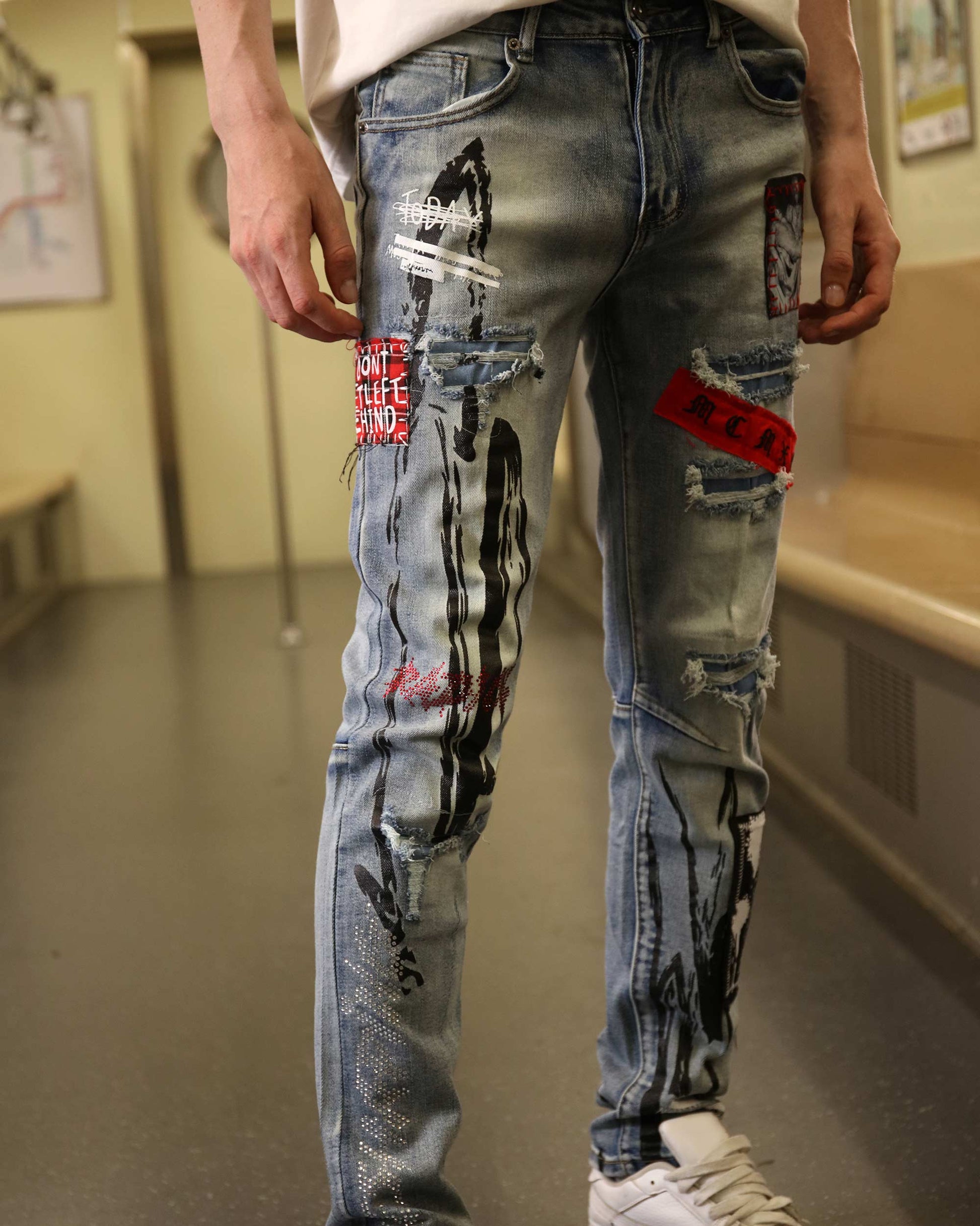 Logeqi medium wash ripped jeans with artistic patches and distressed details for edgy style