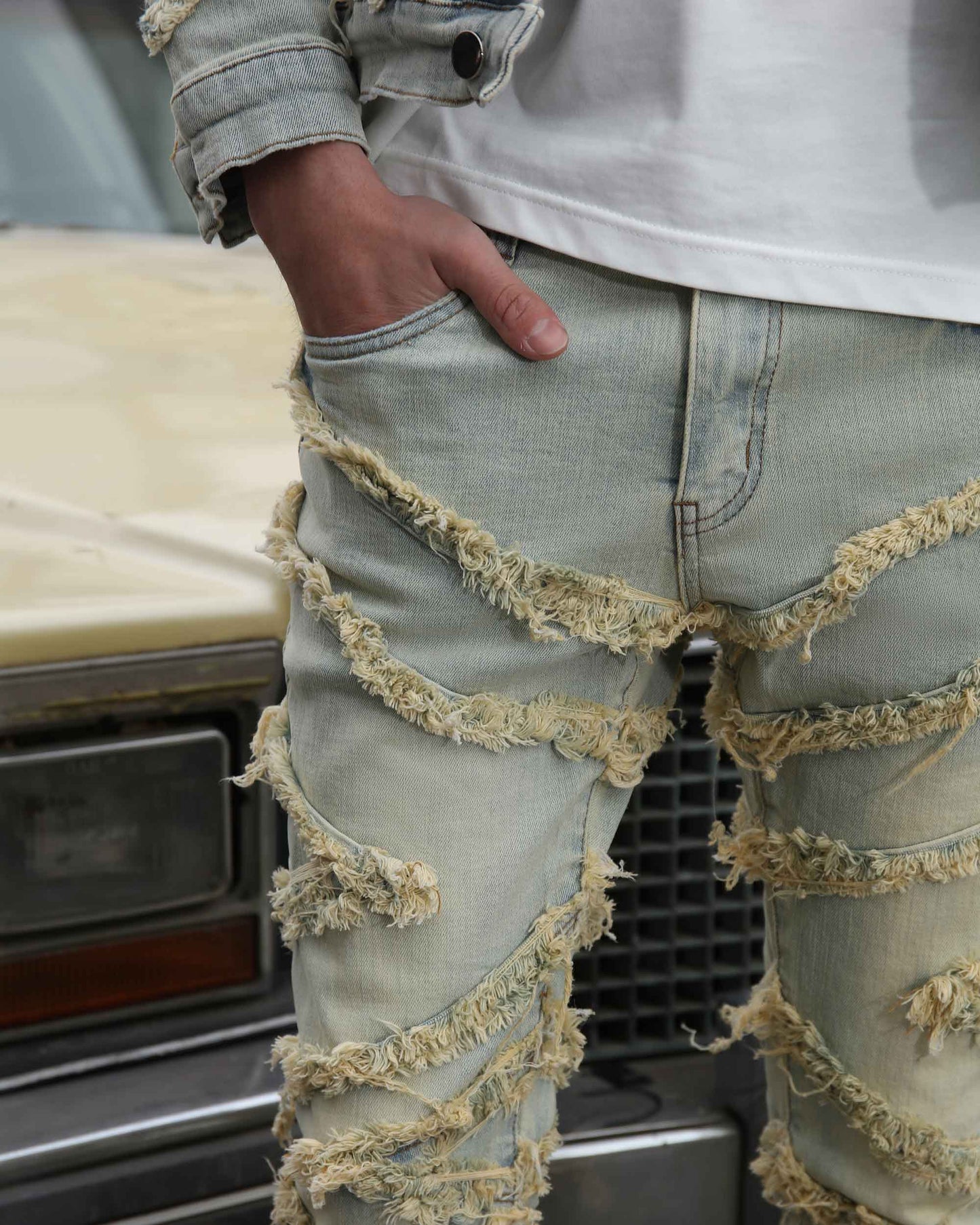 Logeqi vintage distressed blue jeans with unique frayed detailing and a relaxed fit