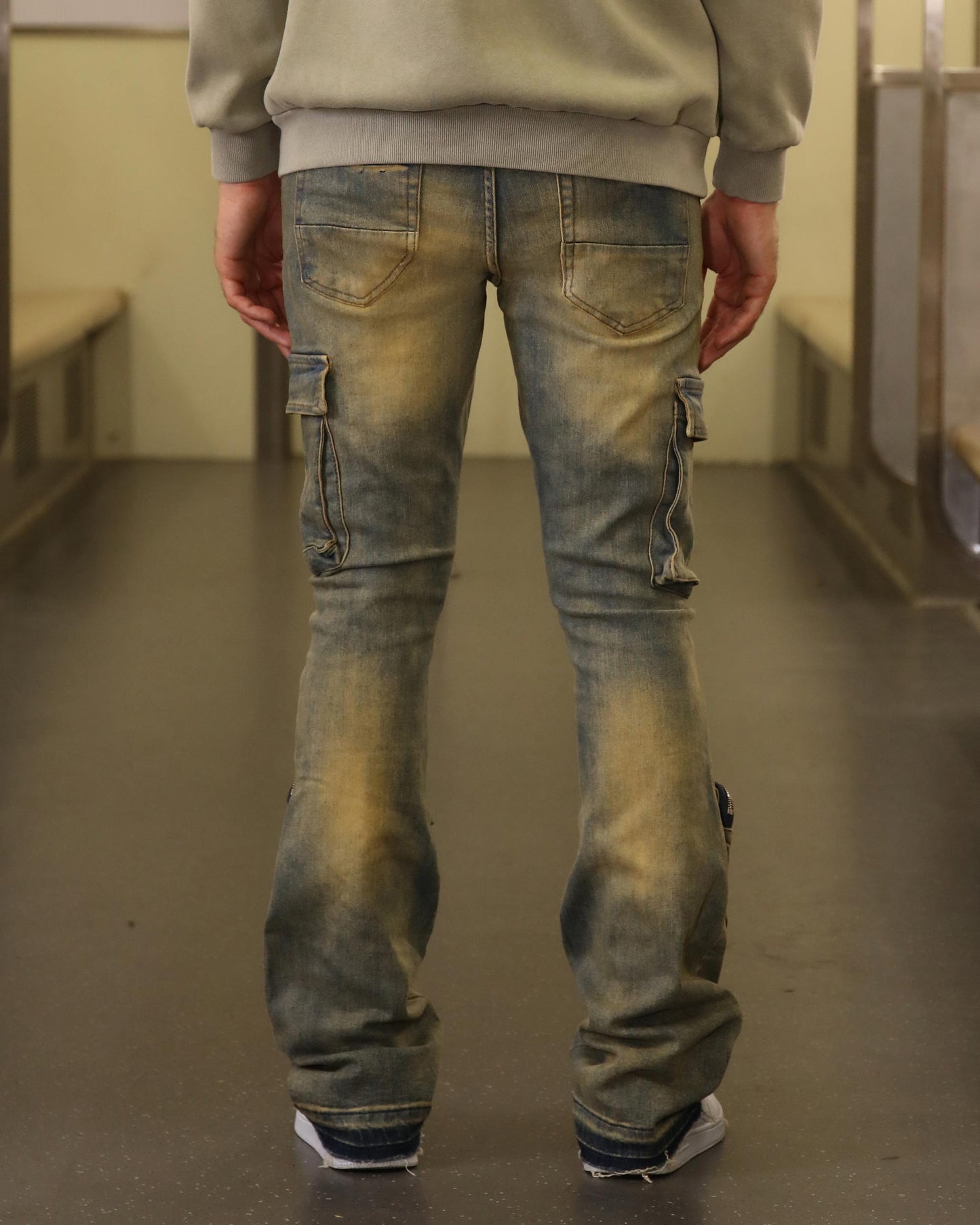 Back view of Logeqi vintage distressed cargo jeans with pockets and a faded finish