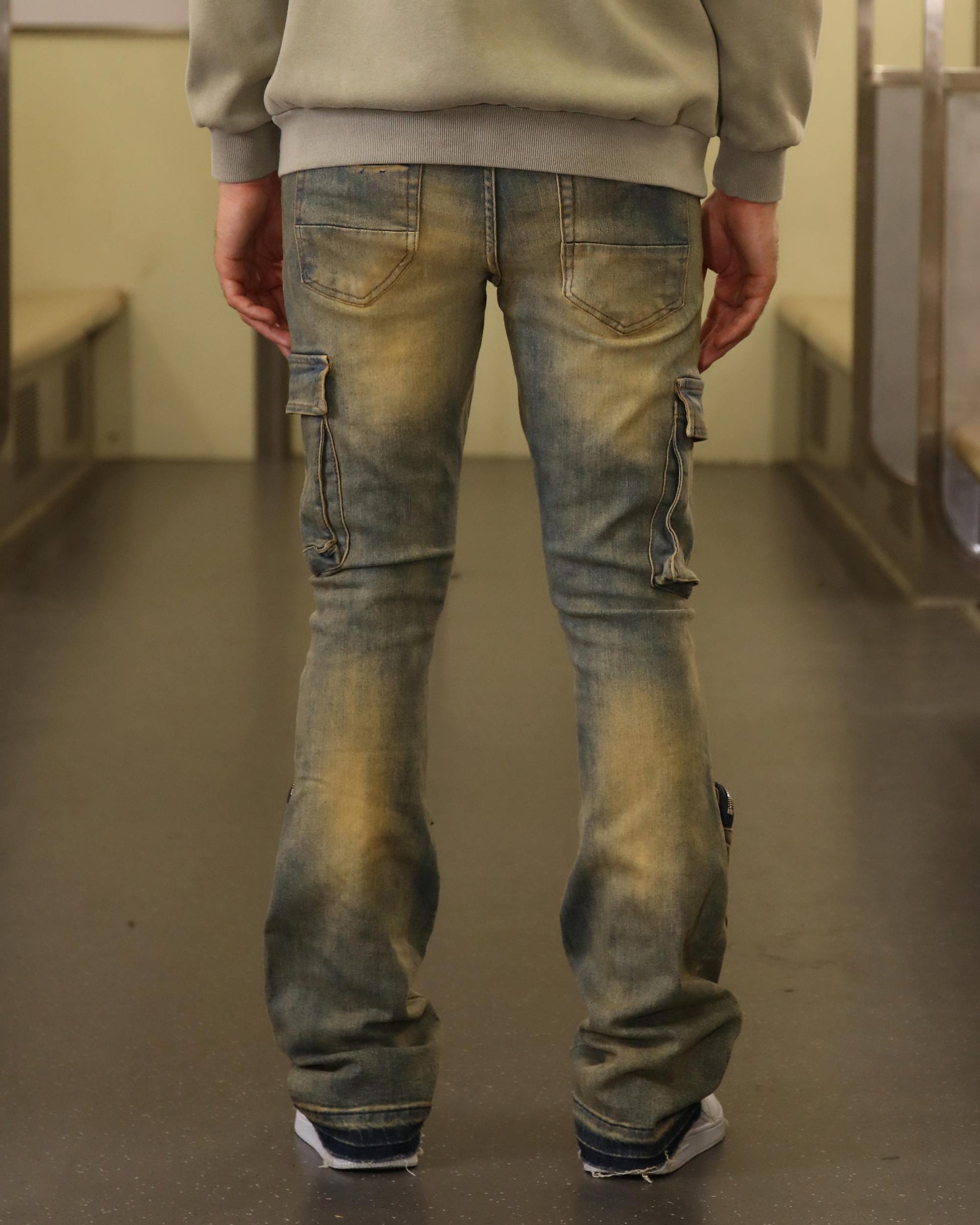 Back view of Logeqi vintage distressed cargo jeans with pockets and a faded finish