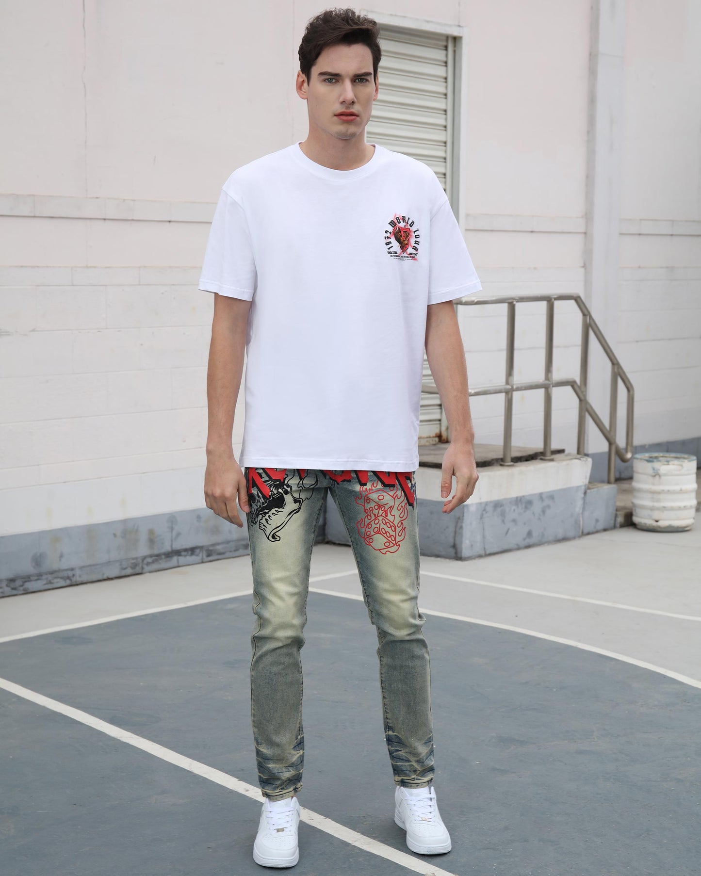 Logeqi vintage graffiti jeans worn by male model paired with white graphic t-shirt and white sneakers