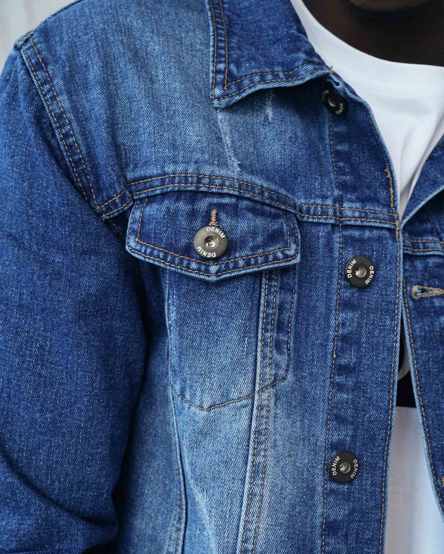 Logeqi washed blue denim jacket featuring classic button detailing and a stylish design