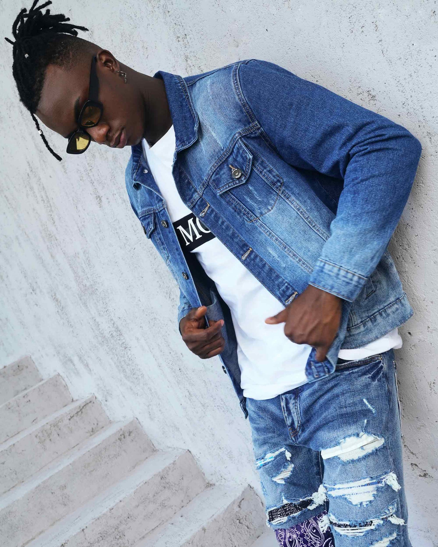 Logeqi washed blue denim jacket worn over a white t-shirt, styled for urban fashion