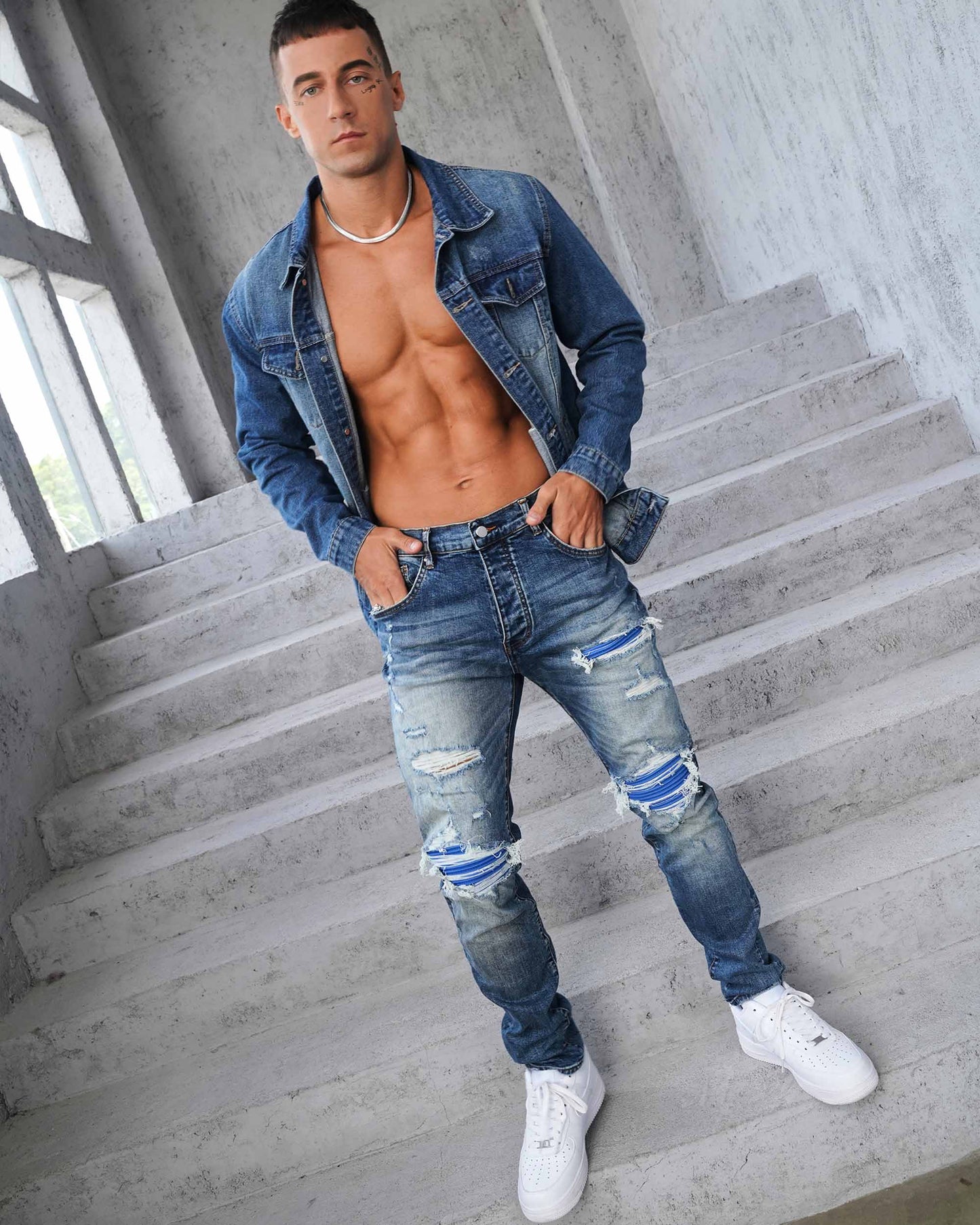 Logeqi washed blue denim jacket paired with ripped jeans for a trendy casual look
