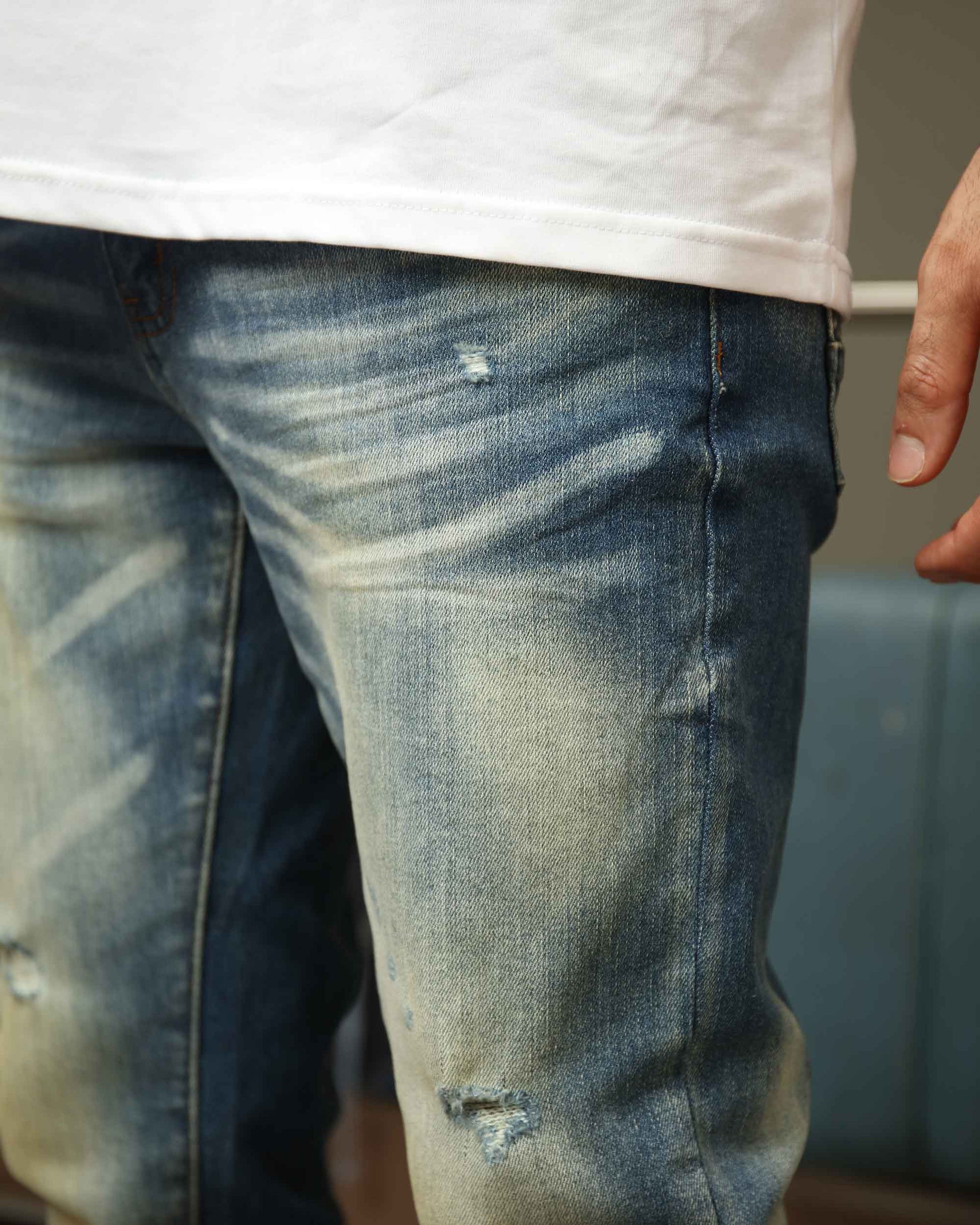 Logeqi whiskered distressed jeans featuring a stylish worn look and comfortable fit