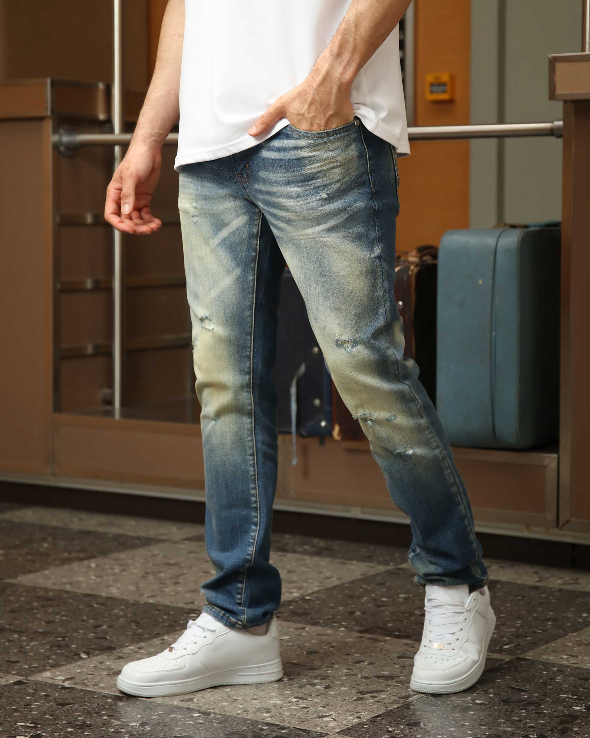 Logeqi men's whiskered distressed jeans with a relaxed fit and light blue wash
