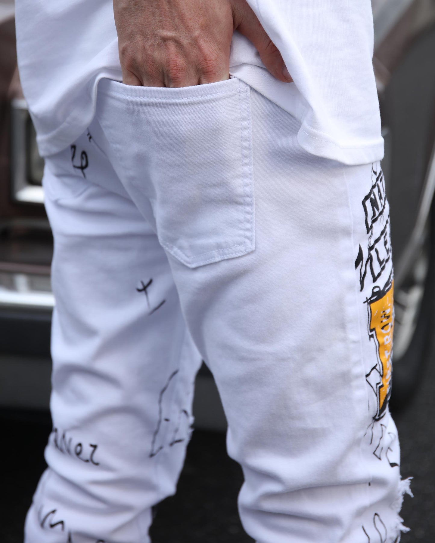 White ripped jeans graffiti featuring unique designs and a modern fit for stylish wear