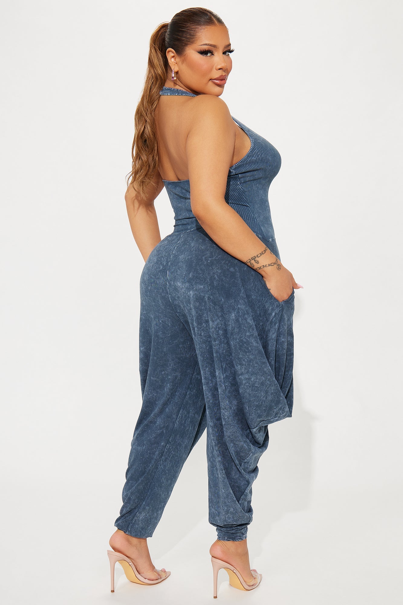 Fashion Nova navy blue jumpsuit for women with halter neck and draped style for a trendy look