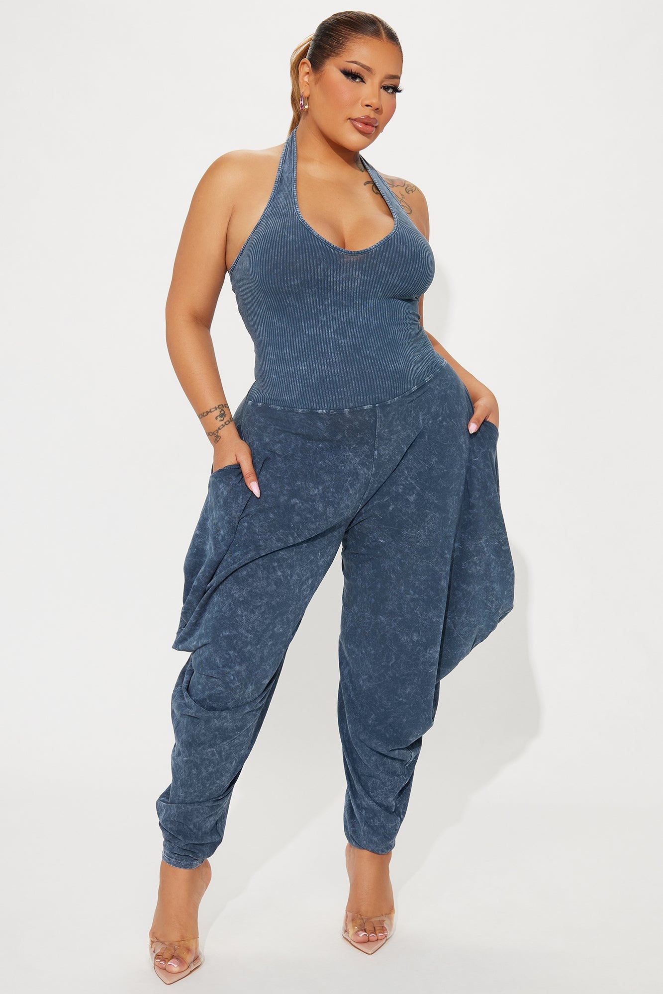 Fashion Nova navy blue jumpsuit for women with halter neckline and stylish draped design