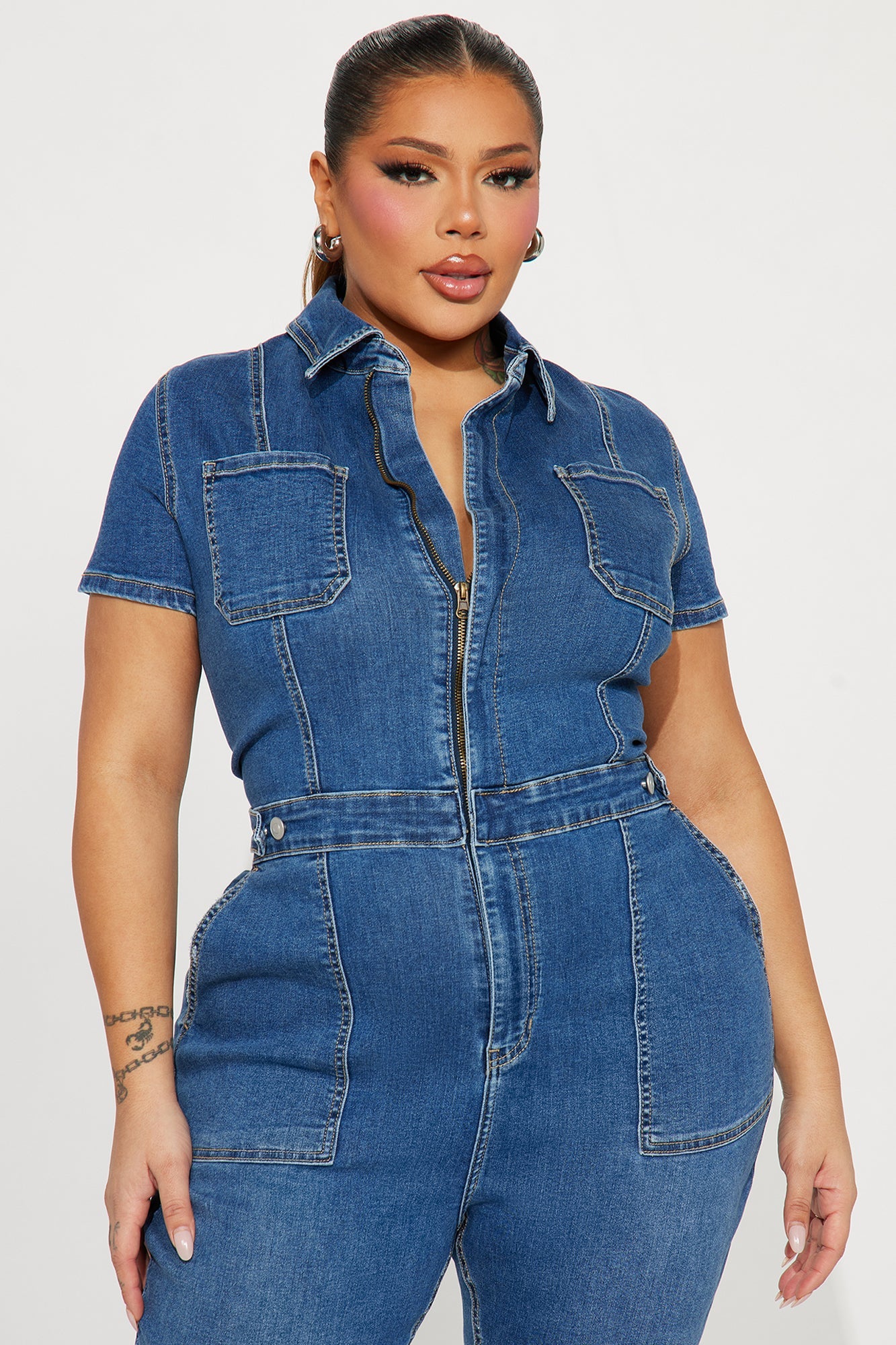 Fashion Nova women's denim jumpsuit medium wash with short sleeves and front pockets