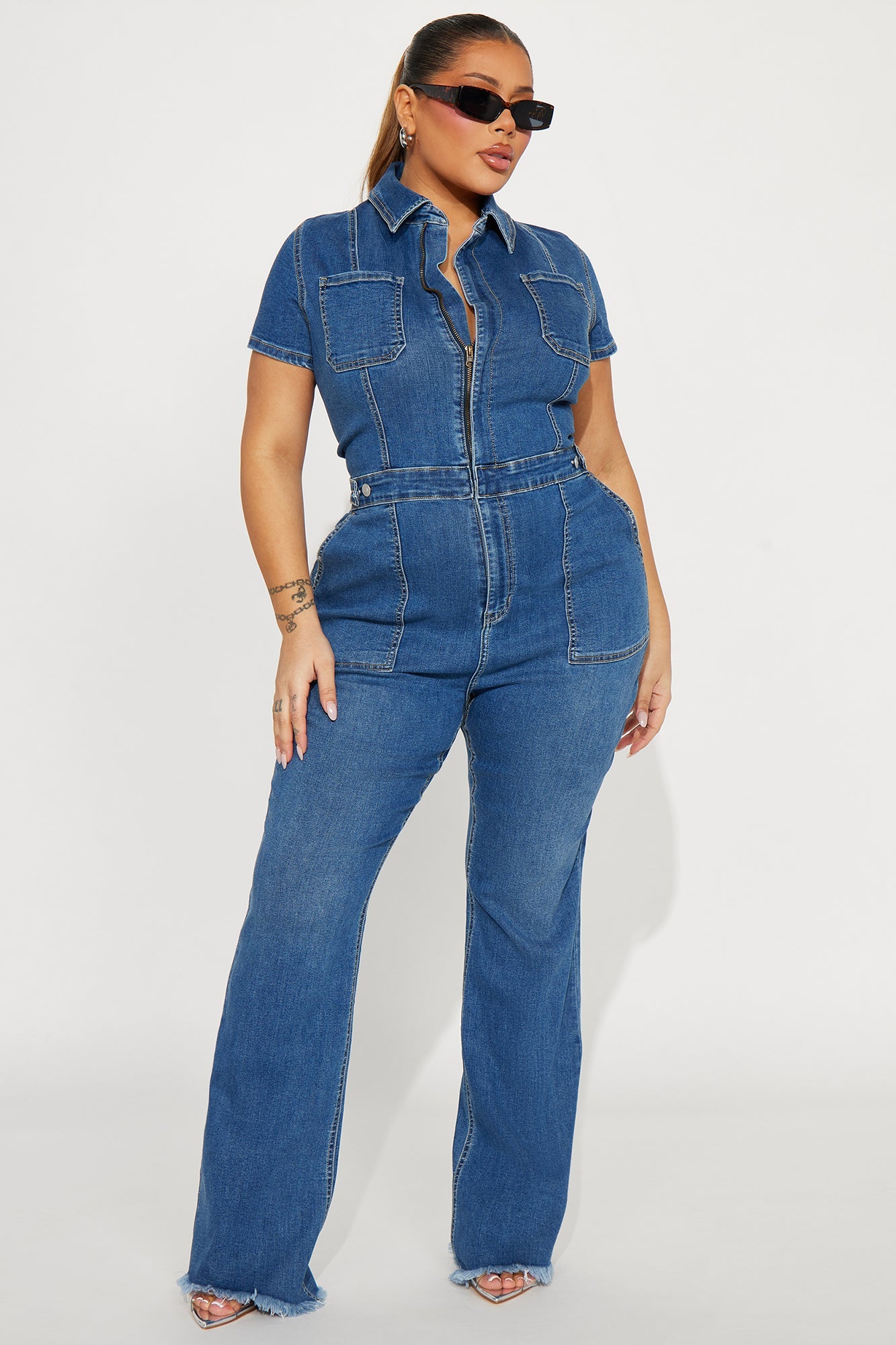 Fashion Nova women's denim jumpsuit medium wash with short sleeves and flared legs