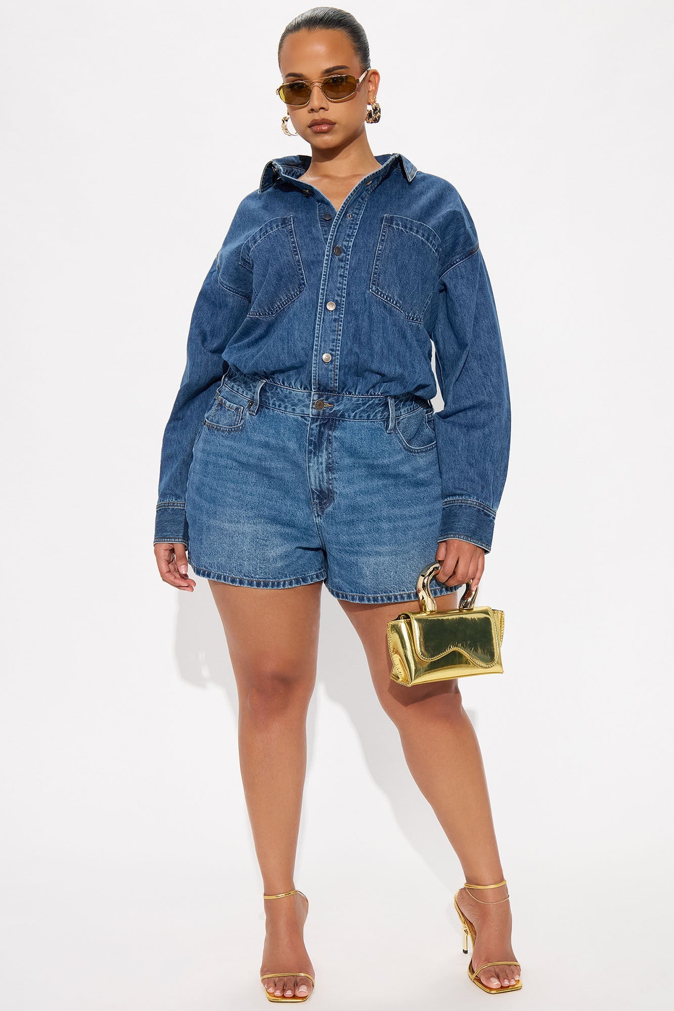 Sleek women's denim romper by Fashion Nova with a button-up design and stylish shorts