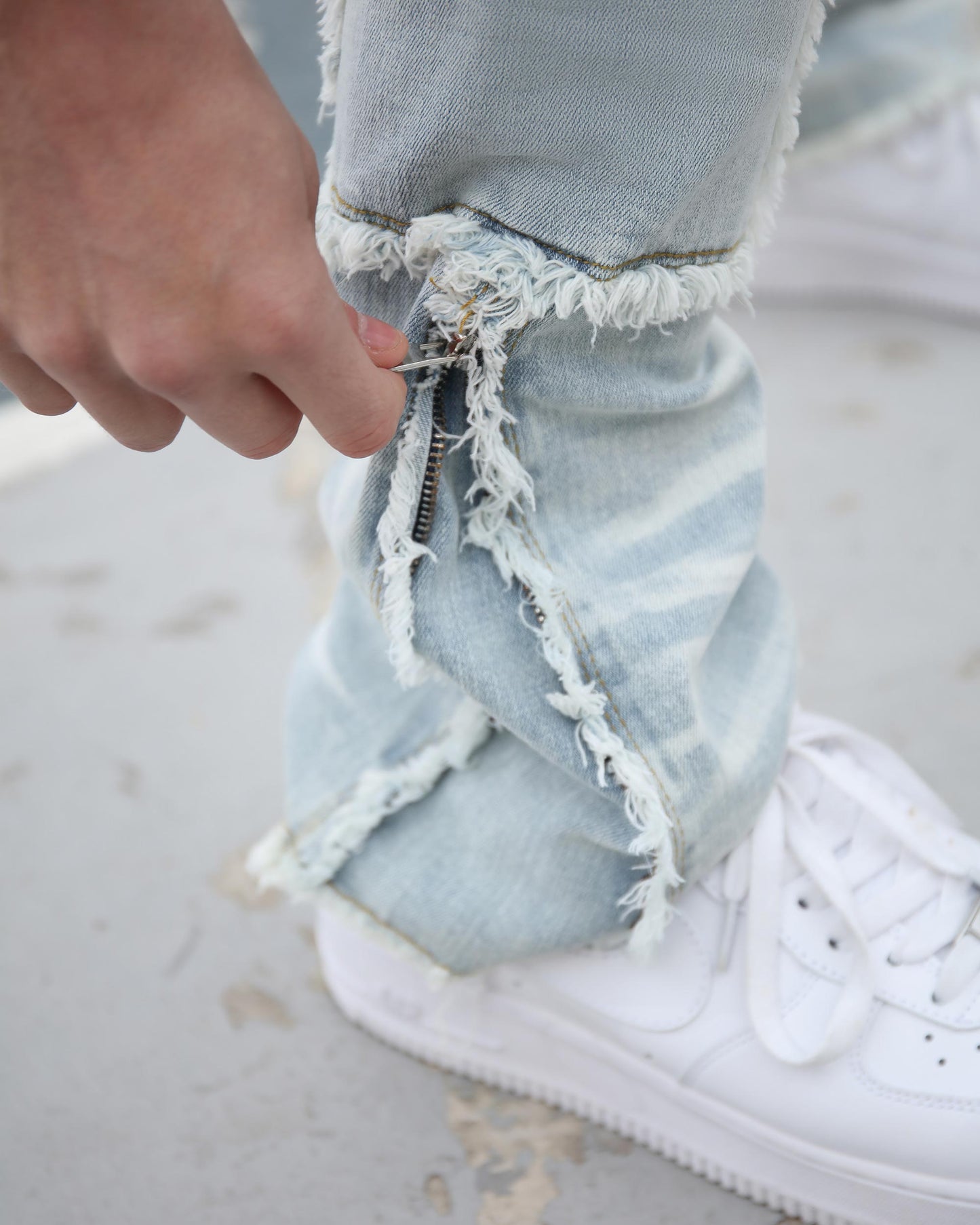 Logeqi workwear flared jeans featuring distressed hems and a detailed zipper for a stylish look