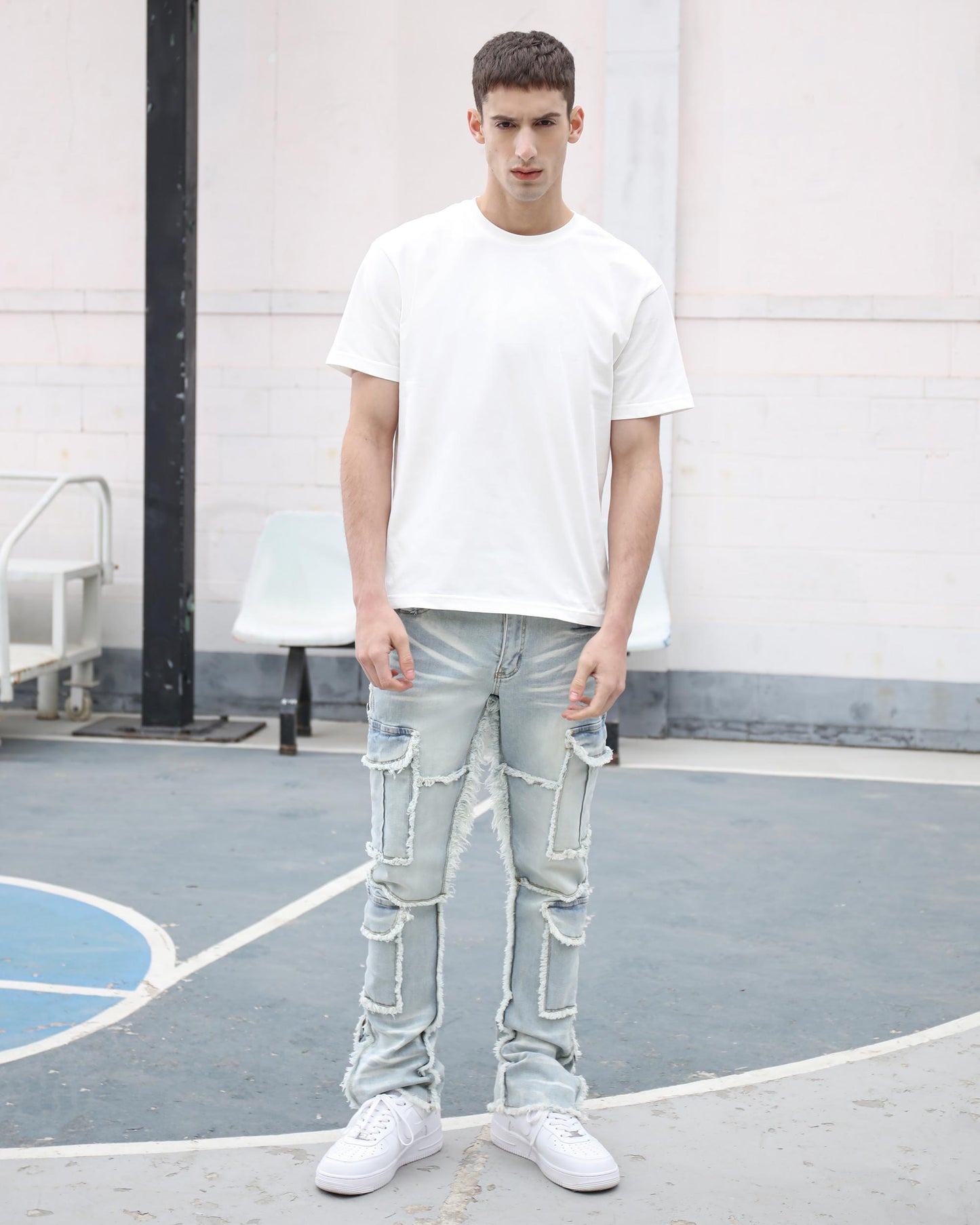 Logeqi workwear flared jeans in light wash with distressed detailing for a stylish casual look