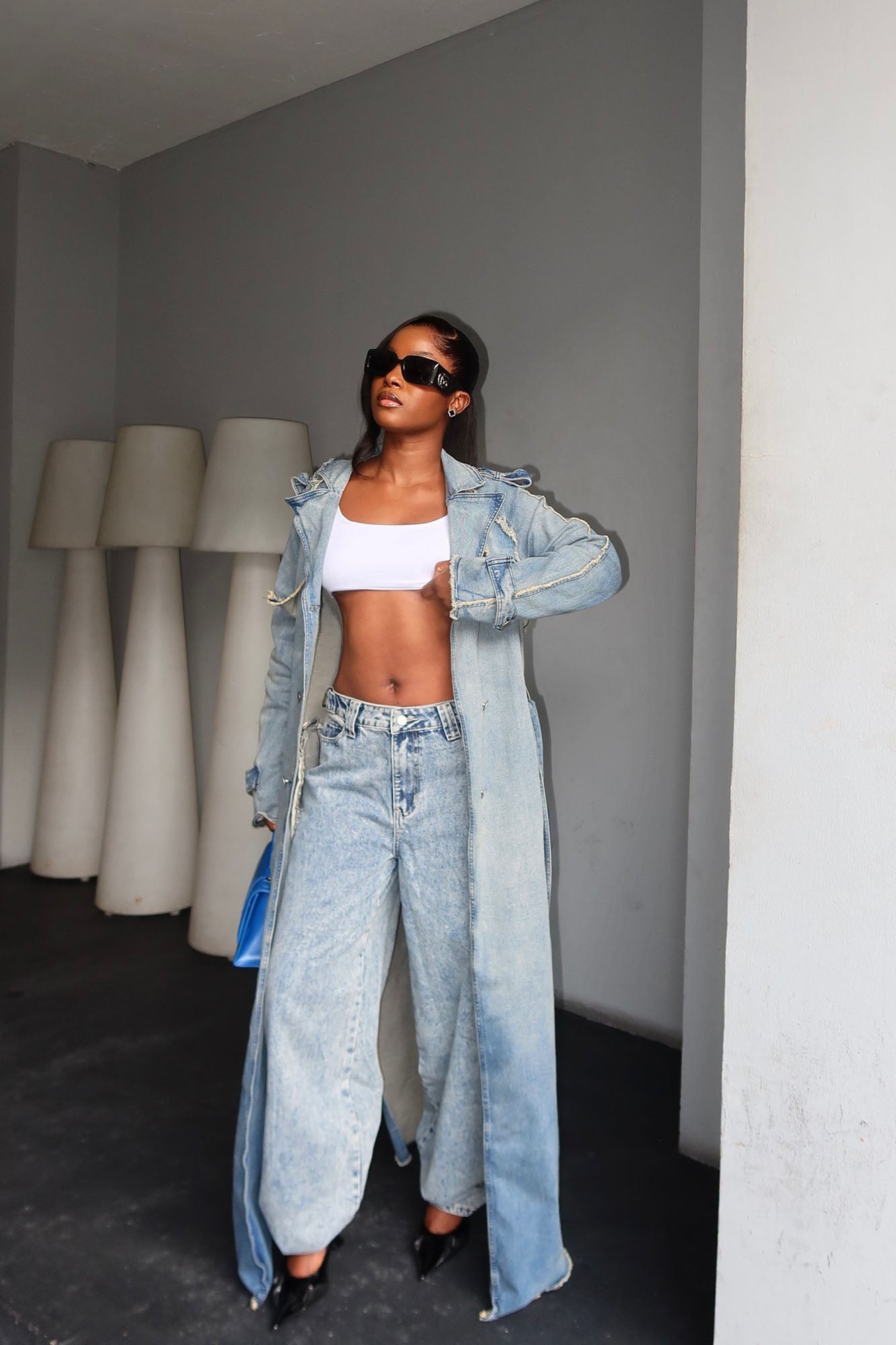 https://cdn.shopify.com/s/files/1/0293/9277/files/11-25-2024__457_New_York_Days_Denim_Coat_Light_Wash_LA.jpg?v=1734999146