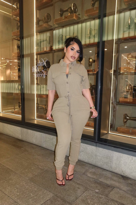 https://cdn.shopify.com/s/files/1/0293/9277/files/12-18-2024__131_Surviving_Summer_Jumpsuit_Olive_WG_JR.jpg?v=1743189516