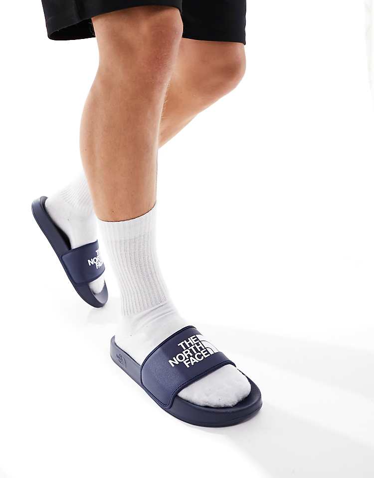 https://images.asos-media.com/products/the-north-face-base-camp-iii-slides-in-navy-and-white/205315099-1-summitnavytnfwhite?$n_750w$&wid=750&fit=constrain