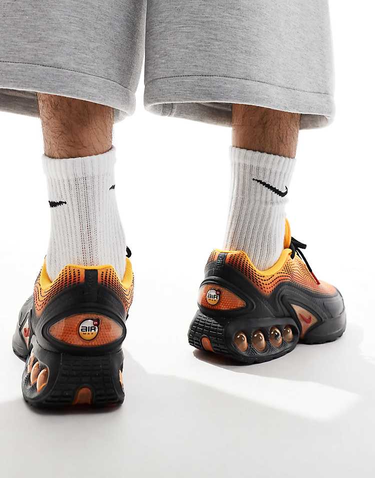 https://images.asos-media.com/products/nike-air-max-dn-trainers-in-black-and-orange/206702589-5?$n_750w$&wid=750&fit=constrain