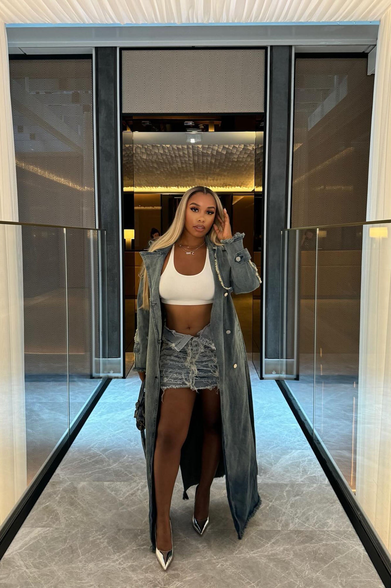 https://cdn.shopify.com/s/files/1/0293/9277/files/7-22-2024__213_New_York_Days_Denim_Coat_Light_Wash_LA.jpg?v=1722962901