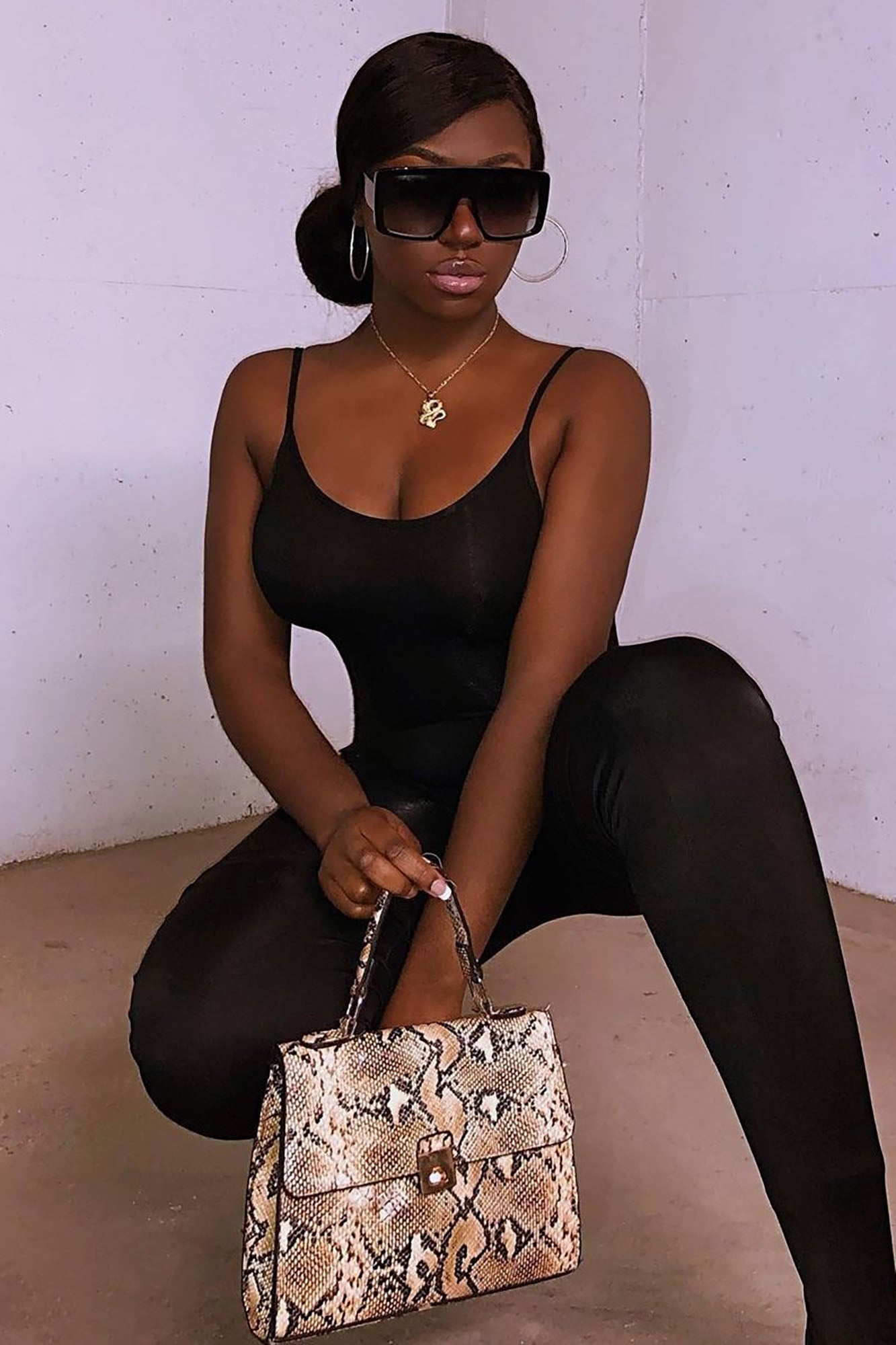 https://cdn.shopify.com/s/files/1/0293/9277/products/NovaSeasonJumpsuit-Black_3__MER.jpg?v=1691624022