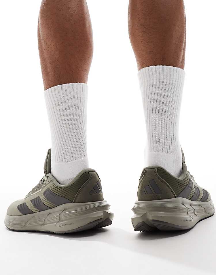 Men's adidas Questar 3 olive green sneakers with cushioned sole and sleek design for active lifestyles