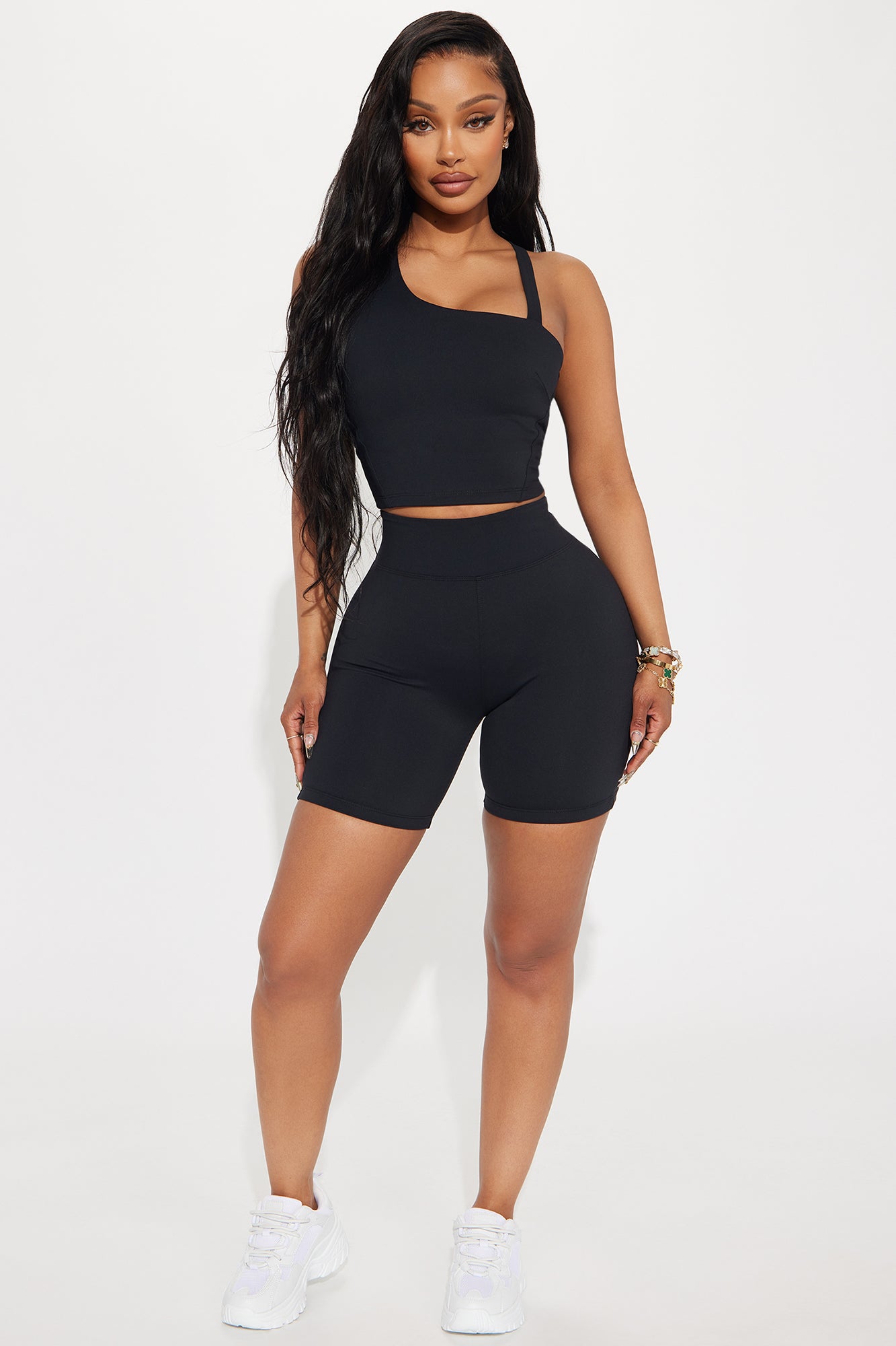 Fashion Nova black biker shorts for women paired with a matching crop top for a stylish active look