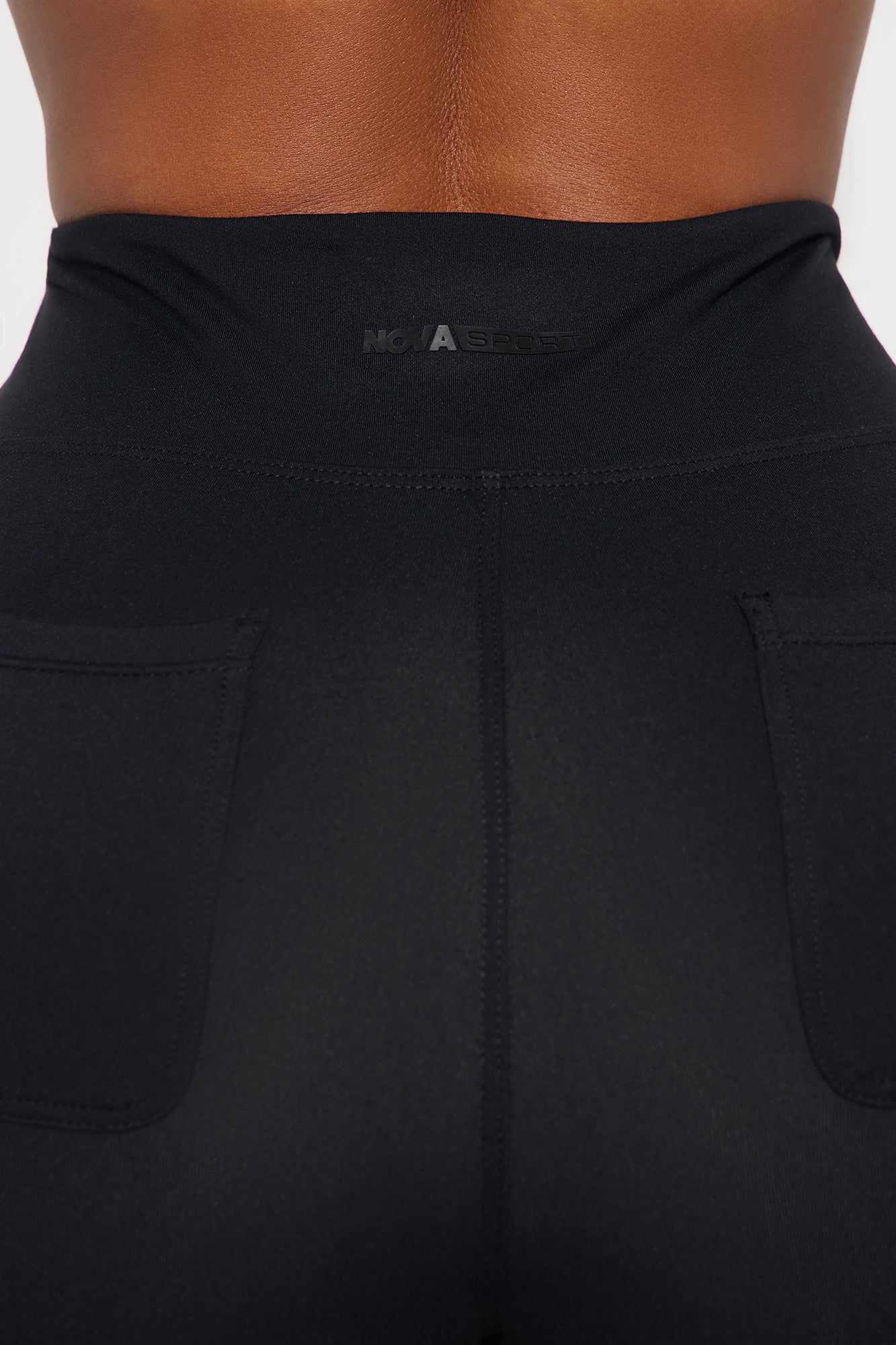 Close-up of Fashion Nova black biker shorts for women featuring a high-waist design and pockets