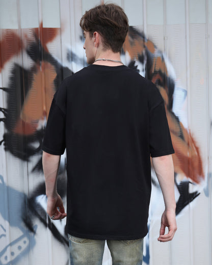 Back view of black cotton t-shirt by Logeqi, featuring an oversized fit and comfortable material