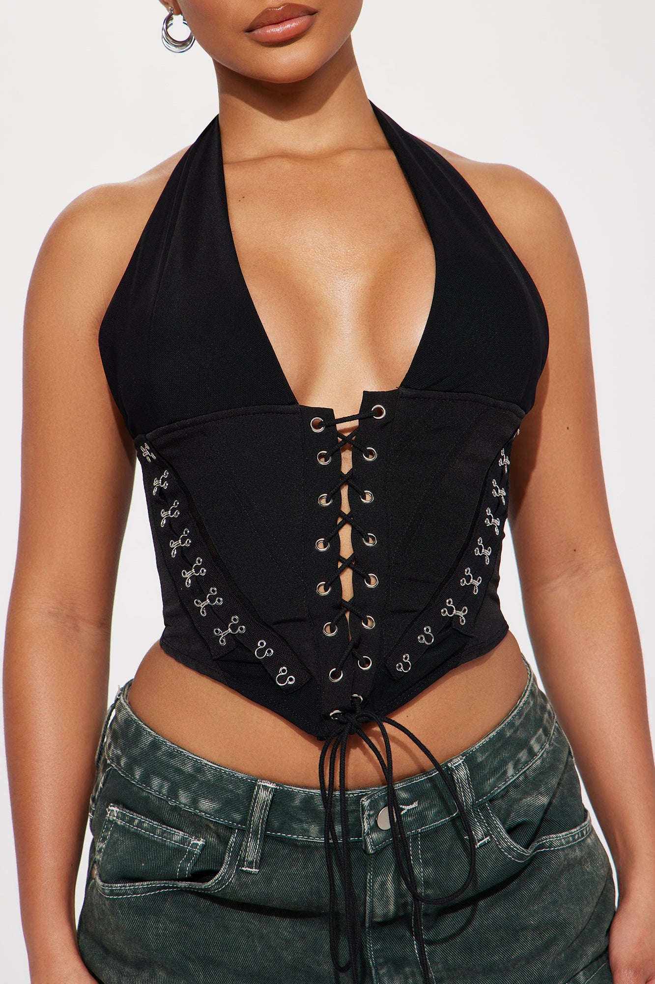 Black lace up halter top with adjustable ties and fitted design for a stylish look