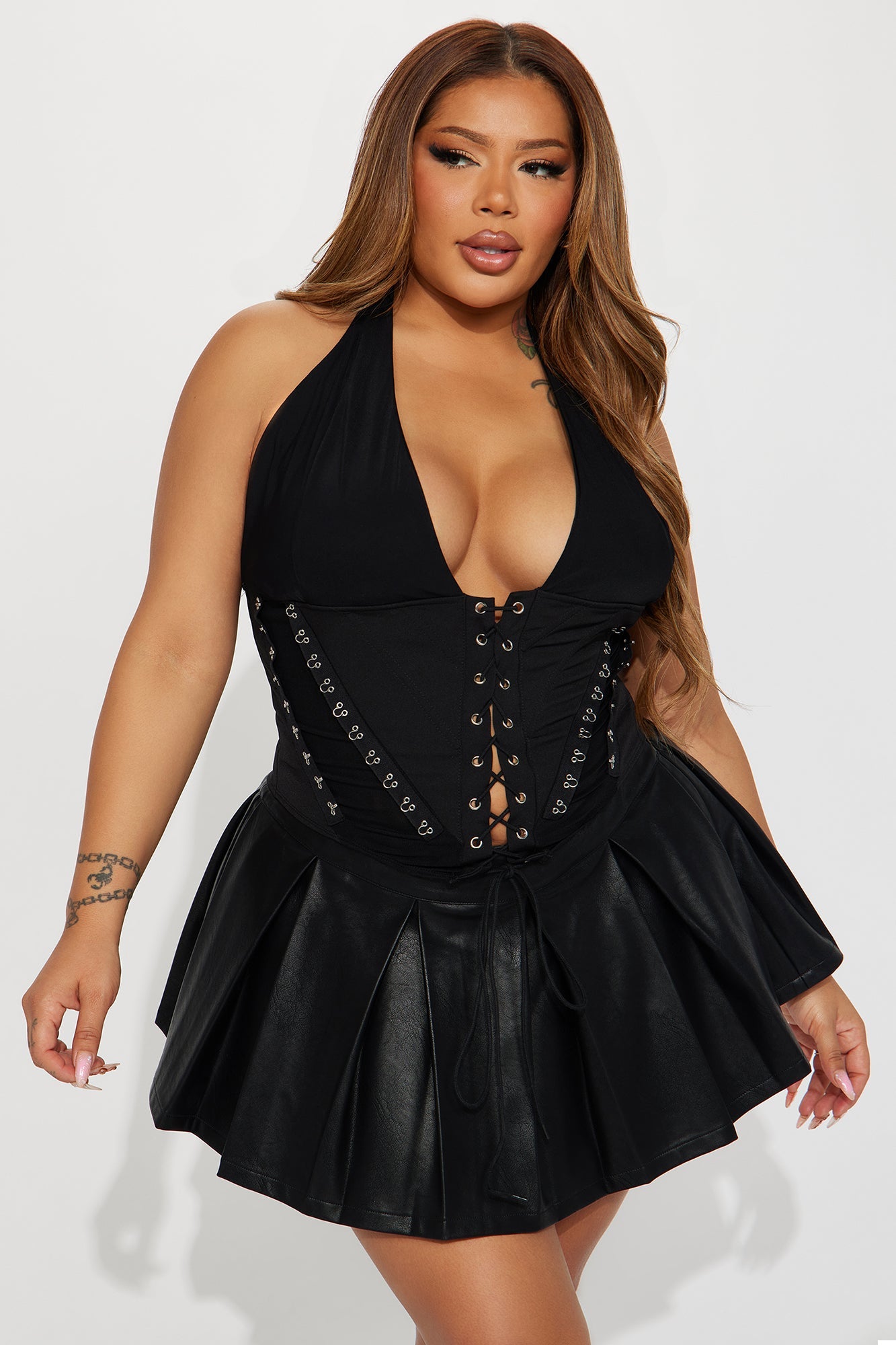 Fashion Nova black lace up halter top with deep neckline and stylish design, perfect for a night out