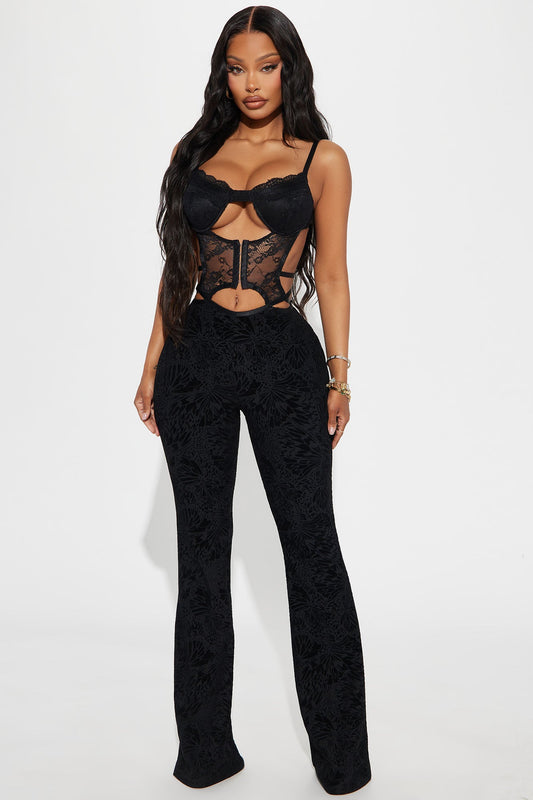 Fashion Nova black mesh jumpsuit for women with stylish lace details and flared legs