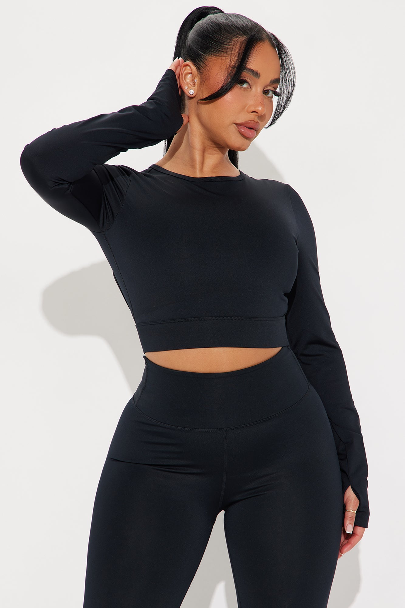 Fashion Nova black open back active top designed for comfort and style during workouts