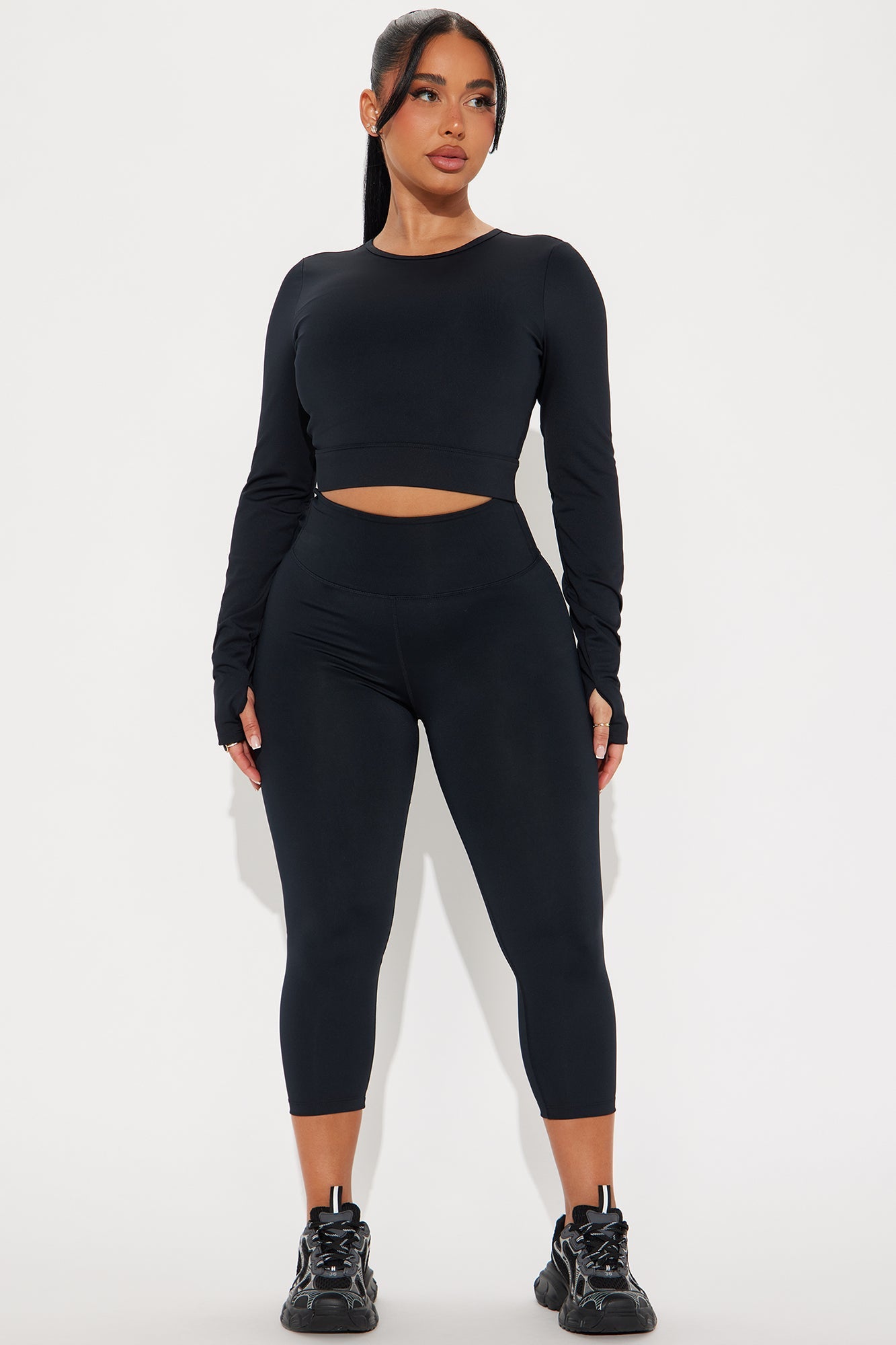 Stylish black open back active top from Fashion Nova, paired with matching leggings for a modern workout look